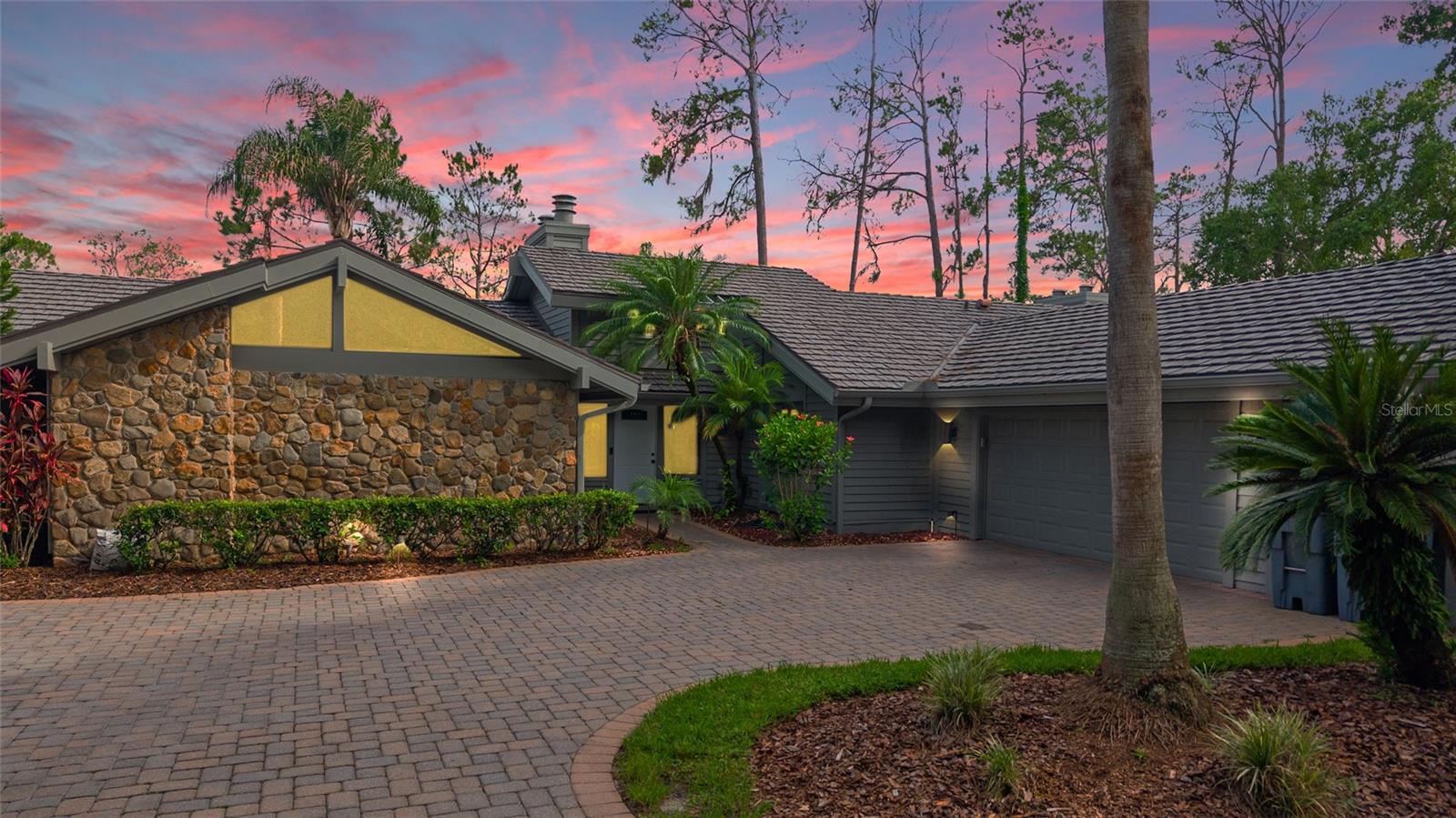 Comfortable and modern living experience within the secure, gated community of Saddlebrook. Located on a quiet dead-end street, the property provides a peaceful retreat with excellent curb appeal, featuring a beautiful stone front and attractive landscaping. The HOA handles all yard and exterior maintenance, giving you a truly low-maintenance lifestyle and more time to enjoy your home.
Step inside and immediately notice the open feel created by vaulted ceilings and a clean, contemporary white paint palette throughout. The home spans approximately 2600 square feet, offering plenty of space. The kitchen is a standout, equipped with stylish shaker-style cabinets, soft-close drawers, and beautiful granite countertops, all illuminated by recessed canned lighting.
The functionality of this home is exceptional. Every bedroom has its own private, ensuite bathroom, a rare and convenient feature for residents and guests. Additionally, there is a large bonus room at the back of the house that provides a versatile space for a media room, home office, or extra living area. The home also boasts ample storage and a unique garage setup, including both an attached garage and a dedicated golf cart garage. Finish your day relaxing on the screened-in patio, accessible through sliding glass doors, perfect for enjoying the Florida weather.