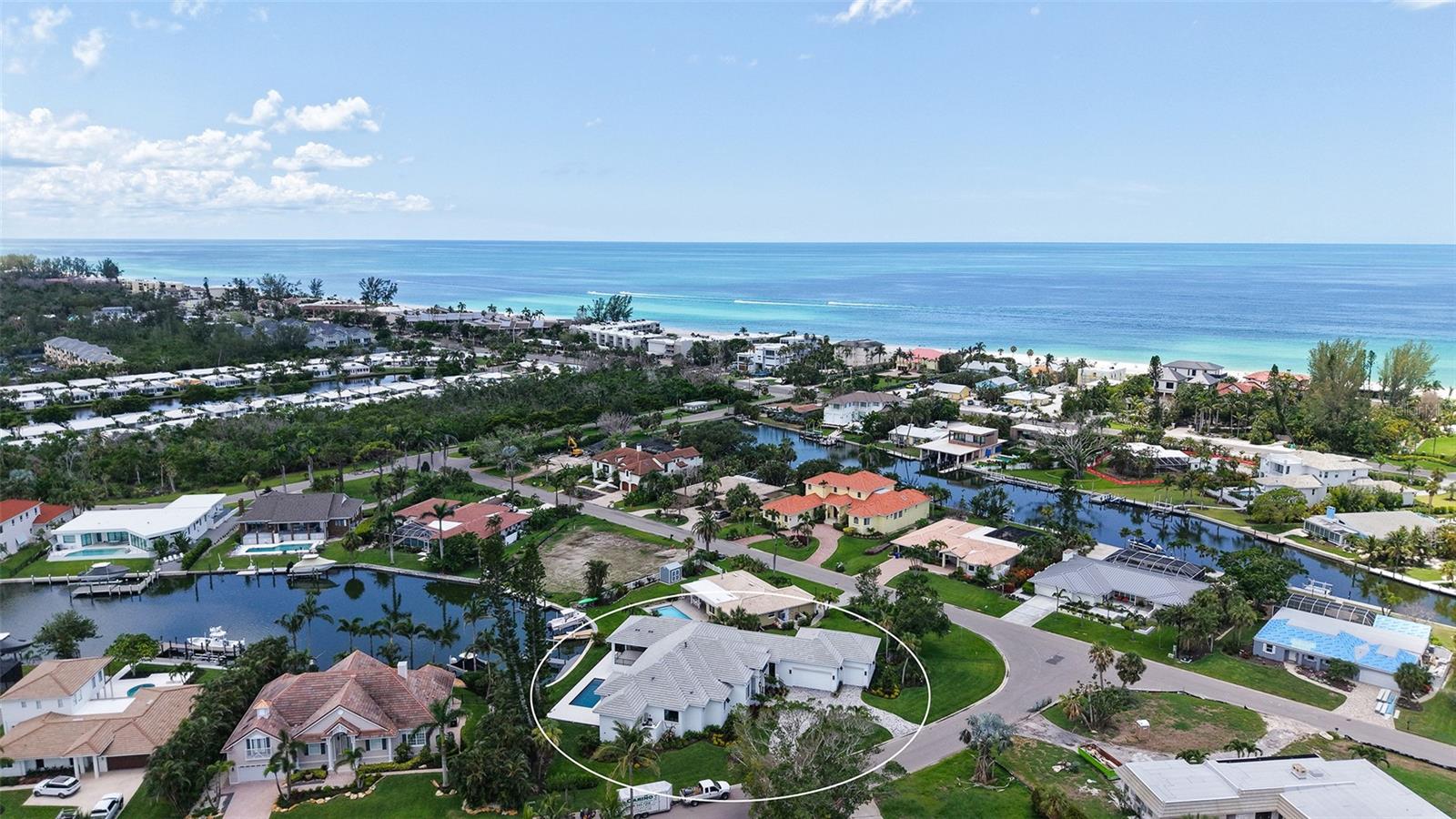 Experience brand-new coastal luxury in this just-completed custom home, finished in June 2025 and located in the sought-after Emerald Harbor community on Longboat Key. Positioned on a spacious corner lot along a wide canal, this one-story residence offers the perfect blend of elegance, function, and laid-back Florida living. With direct beach access across the street and your own boat dock in the backyard, the location couldn’t be more ideal.
Inside, the home features beautiful hardwood floors throughout, soaring ceilings including twelve-foot heights in select rooms and a thoughtfully designed floor plan with three bedrooms, an office, a game room, fitness room, and a sitting area. The layout easily allows for conversion to five bedrooms if needed. Off the chef’s kitchen, custom wood beams add warmth and character, while the great room centers around a stunning fireplace, creating a space that feels both luxurious and inviting.
The kitchen is equipped with a full Thermador appliance package, high-end cabinetry, and expansive countertops perfect for entertaining or everyday living. The primary suite is a true retreat, offering two oversized walk-in closets and a luxurious his-and-her bathroom setup with dual vanities and a soaking tub.
Step outside to your private resort-style escape, complete with a gorgeous pool, elevated spa, and fully outfitted outdoor kitchen. The oversized four-car garage has high ceilings and is ready for multiple car lifts, ideal for car enthusiasts or extra storage.
Built to the latest codes and engineered for peace of mind, this home is just minutes from the Longboat Key Club, Anna Maria Island, and St. Armands Circle. Surrounded by nature, you’ll enjoy watching dolphins, manatees, and native birds right from your backyard.
This is Florida living elevated, effortless, and ready for you.