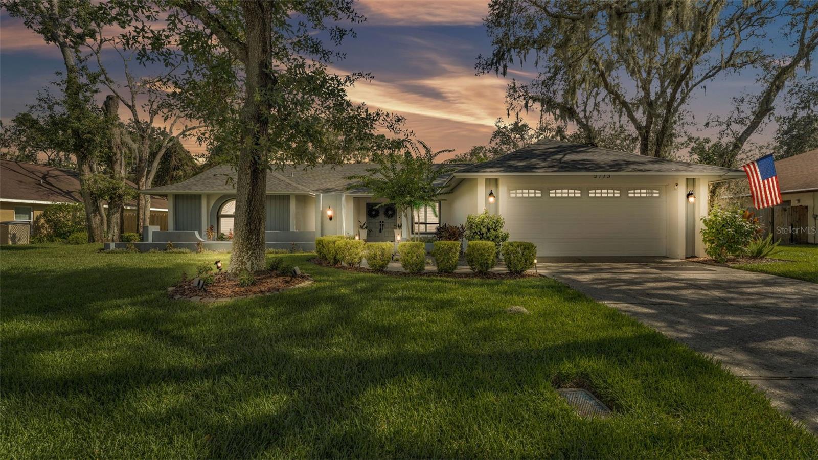Discover the perfect blend of comfort, style, and Florida living in this beautiful 4-bedroom, 2-bathroom pool home located in the Hammocks neighborhood of Walden Lakes in Plant City, FL. Designed with an open floorplan, this home welcomes you through a double door entry with a bright and inviting living space, enhanced by skylights that fill the room with natural light. Two sets of sliding glass doors look out onto the spacious lanai and crystal-clear pool. The house has two primary common areas, the first is the living room/dining room, perfect for entertaining and just steps away from the kitchen. The heart of the home features a spacious kitchen and adjoining family room. The kitchen, with granite countertops, all stainless steel appliances, and plenty of cabinetry, is ideal for preparing food. A two-tiered breakfast bare is great for both everyday meals and entertaining. The adjoining family room boasts vaulted ceilings and a cozy fireplace, creating a warm and inviting atmosphere. Retreat to the private primary bedroom with its own en suite bath and connected nursery or home office (flexible 4th bedroom-it has a private entrance too), while two additional bedrooms provide flexibility for guests or hobbies. Step outside to your own backyard oasis with a covered lanai, where a sparkling pool awaits, surrounded by a fully fenced yard for privacy and peace of mind. Relax and make the most of your personal space after a long day’s work. The property has loads of upgrades, including a new roof (2025), plantation shutters throughout, a new mini-split AC unit for the primary suite, an electric vehicle charging station, and so much more. Located in a picturesque, established community with tree-lined streets, this home offers easy access to shopping, dining, entertainment, parks, and major highways.