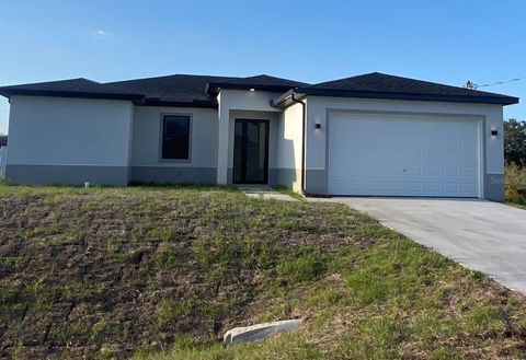 Photo of 2614 71st Street W, Lehigh Acres, FL 33971 (MLS # C7509459)