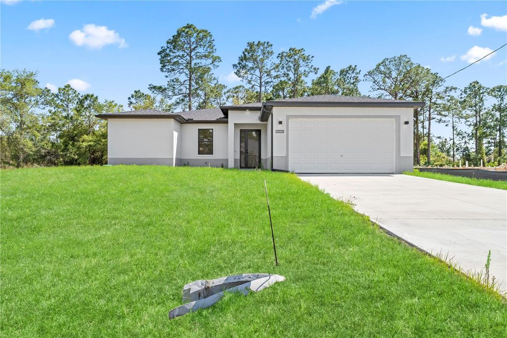 Photo of 2614 71st Street W, Lehigh Acres, FL 33971 (MLS # C7509459)