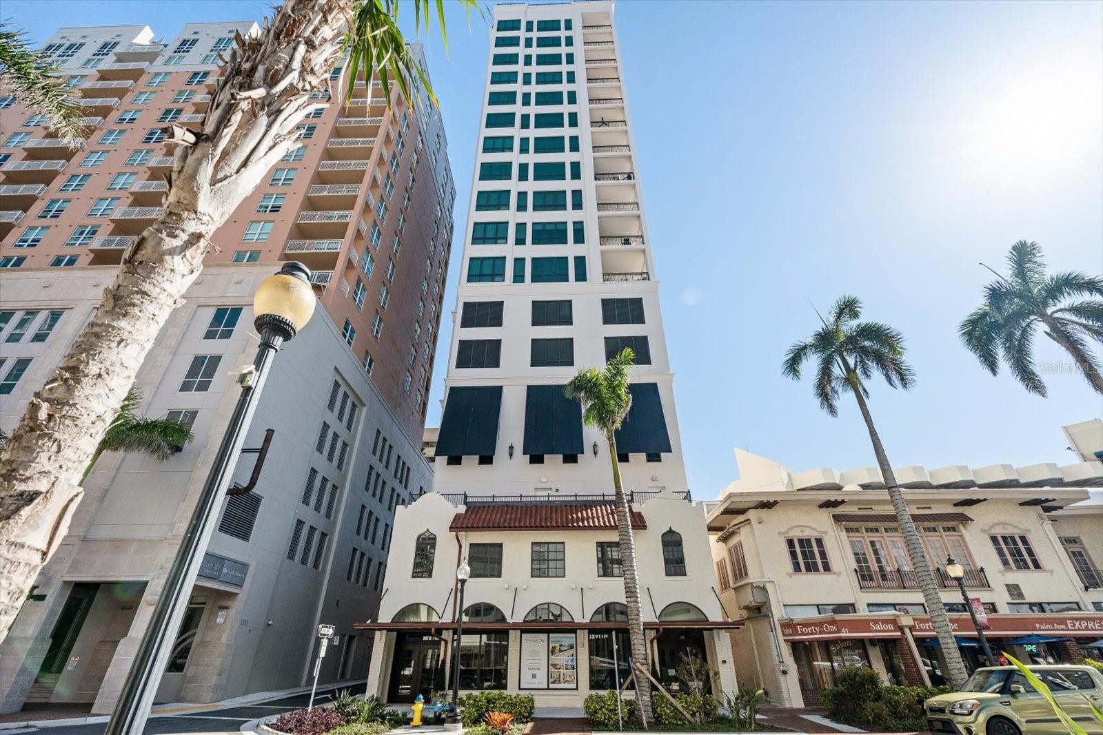 Price Improvement !!!Best price per square foot in the building. Ready for immediate occupancy, Never-Lived in 2 bedroom 2 full bath residence at the Demarcay in Downtown Sarasota. The unit features partial water views and sweeping views of the downtown skyline. Discover the pinnacle of Downtown luxury living in this exquisite 11th floor open concept unit on esteemed Palm Avenue, known for its walkability to countless restaurants and Marina Jacks. The unit features a top-of-the-line kitchen which is a chef’s dream, equipped with premium Miele appliances, a Gas Miele cooktop which is ideal for both everyday cooking and entertaining. Attention to detail with the imported Italian cabinetry and quartz countertops will be sure to please. The expansive master suite is a private sanctuary, with automatic blinds on the windows, allowing you to wake up to Sarasota’s natural beauty each day, with the click of a button. In the Master bath the same quality continues with quartz counters, imported Italian cabinets, and automatic blinds. Enjoy your oversized walk-in closet only a few steps away. The spacious living room and dining room also have newly installed electric blinds and perfect proximity to the kitchen for convenience. Step out onto the spacious balcony to experience daily sunsets over the bay and enjoy a front-row seat to Fourth of July fireworks, creating memorable experiences right from your home. This luxurious condo provides an unparalleled lifestyle with a secure parking spot where your car is taken up one of the two car elevators and parked in your own secure parking space.This residence includes a storage locker, and exclusive access to the rooftop salt water pool with 360 degree stunning bay and city views, spacious entertaining areas ,and rooftop grilling area.Pamper yourself and your pets with a pet-friendly atmosphere and entertain guests in style. The complete fitness center offers state-of-the-art equipment for an active lifestyle. On-site staff is available 24/7 providing resident services for owners whether they are in town or traveling, creating a true peace of mind and convenient feeling. Located just a short walk away from Sarasota's finest dining, upscale shopping, art galleries, and theatres, this condo epitomizes elegance, convenience, and Downtown living at its best. Embrace the Sarasota Bay lifestyle—where luxury meets convenience on Palm Avenue. one or more pictures was virtually staged
