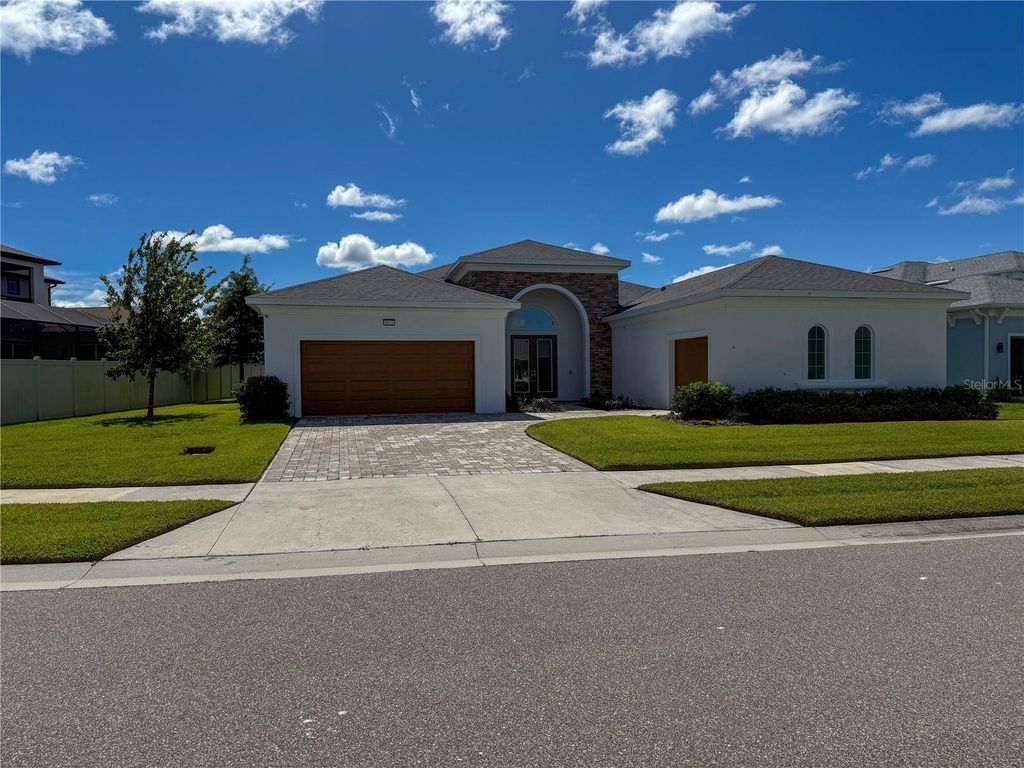 Photo of 8833 Sanders Tree Loop, Wesley Chapel, FL 33545 (MLS # O6352399)