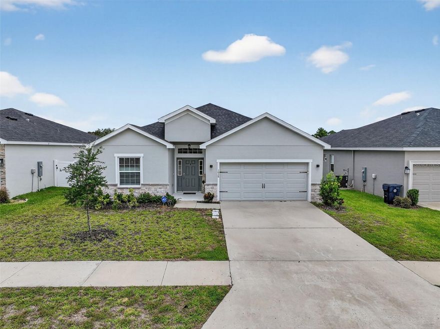 Tucked between Auburndale and Polk City, Auburn Cove blends outdoor lifestyle and convenience. Stroll the neighborhood park with its walking path, picnic tables, benches, and open playfield. Let the dogs run at the dog park, or hop on the Auburndale TECO Trail with direct neighborhood access. With I-4 only two miles away, you’ll enjoy seamless travel to Orlando, Tampa, or Lakeland while keeping you close to local shopping, dining, and recreation. Step inside to experience the 2022 Highland Homes “Shelby” floor plan, thoughtfully designed for today’s lifestyle. The spacious great room showcases an inviting hub for entertaining or quiet nights in, anchored by a chef-inspired kitchen with a large center island, abundant cabinets and counter space, and a 6x7 walk-in pantry. An adjoining dining area brings everyone together, and sliding glass doors lead to the 10x15 screened lanai, ideal for relaxing or enjoying backyard gatherings. The primary suite reveals a retreat with double-door entry, tray ceiling, and 6x7 walk-in wardrobe. The en-suite bath features dual vanities, a tile walk-in shower, private water closet, and an extra linen closet for added storage. Two of the secondary bedrooms are joined by a Jack-and-Jill bath with dual sinks, linen storage, and a tile tub/shower complete with a built-in bench/shelf, while the fourth bedroom provides flexibility for a home office or guest space. Additional highlights include a guest powder room off the foyer and an inside laundry room with counter space for folding, added storage, and a convenient drop zone for bags, backpacks, or shoes. Located near the sought out Berkley Charter School and Florida Polytechnic University, this home combines thoughtful design, modern finishes, and unbeatable location – ready to fit your lifestyle in the heart of Central Florida.