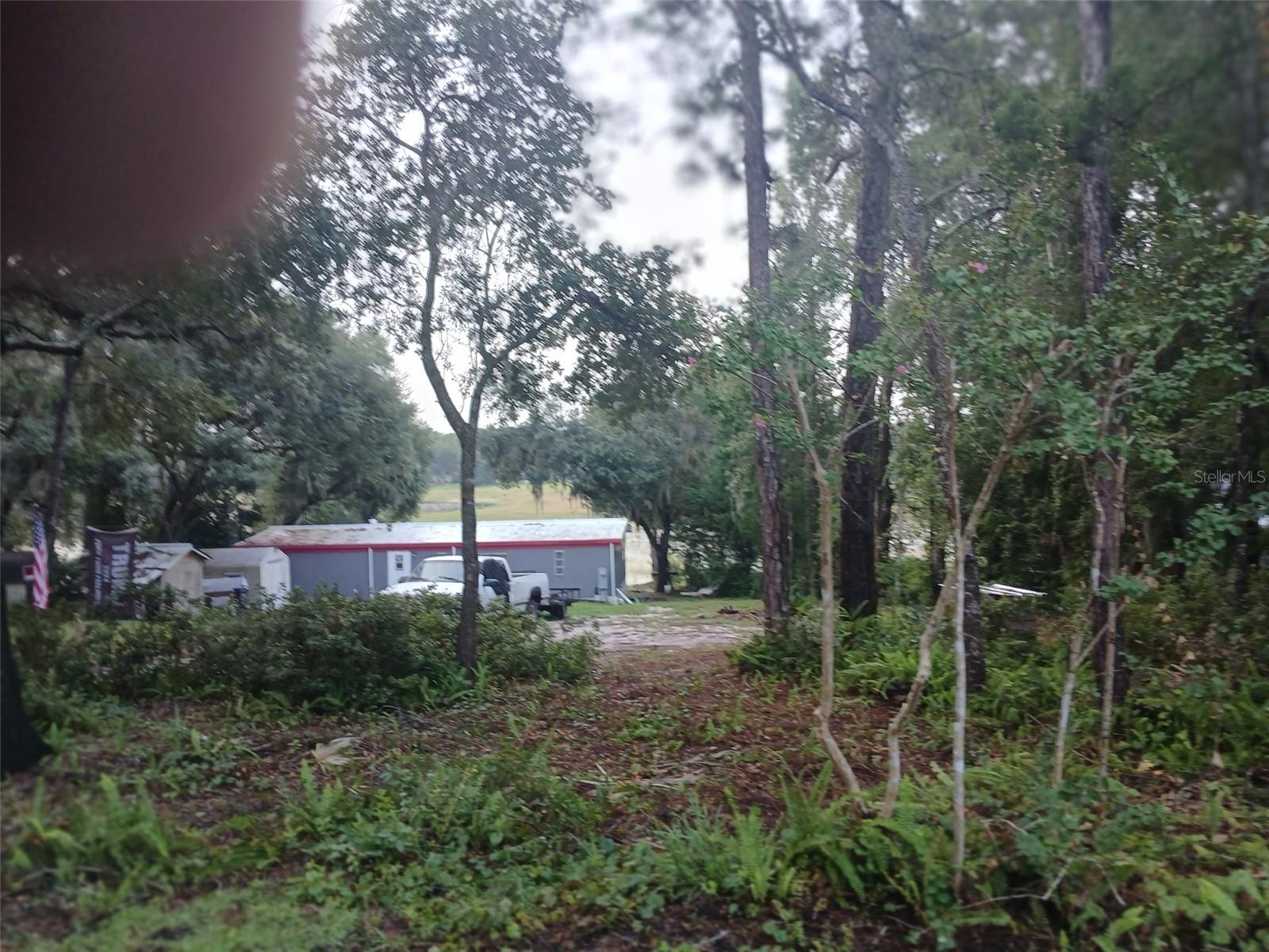 INVESTOR ALERT! LAKEFRONT 2 BEDROOM, 2 BATH MOBILE HOME. OWNER STARTED RENOVATING AND HOME IS READY TO BE FINISHED. HOME HAS AN OPEN CONCEPT. HAS NEW UNDERGROUND ELECTRIC SUPPLY. CLEARED LAKE ACCESS AND VIEW. PLYWOOD FLOORING. 12X30 SCREENED IN ROOM. OPEN WOOD DECK WITH GREAT SUNRISE VIEWS. HOME WOULD MAKE FOR A GREAT VACATION RENTALS LOCATED IN THE OCALA NATIONAL FOREST. ACCESS TO AIRSTRIP IF DESIRE. Shttps://woodsandlakesairpark.org/ Home is located in the Ocala National Forest which affords you almost a ½ million acres of Forest to roam, 600 lakes, 2 rivers, Juniper Springs, Silver Glen Springs, Salt Springs, Swimming, Skiing, Big BASS Fishing, Boating, Camping, Hiking, Horse back riding and some of the best ATV riding anywhere. Daytona Beach is just 1 hour away. Let the fun begin! You need it!