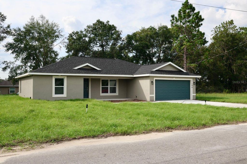 Photo of 194 Malauka Run, Ocklawaha, FL 32179 (MLS # O6352025)