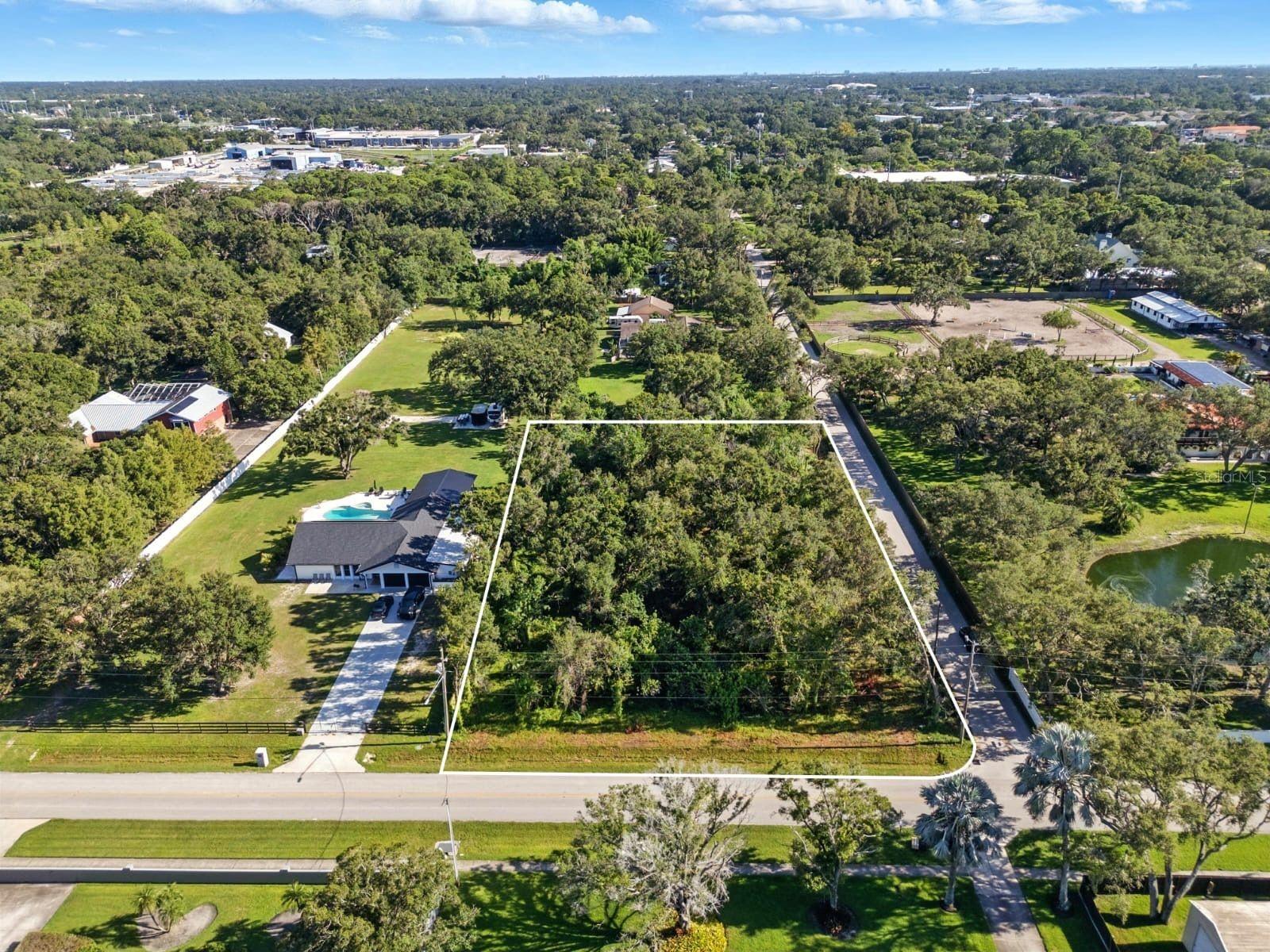 Rare 1.13-Acre Vacant Lot in the Heart of Pinellas Park! Discover a unique opportunity to own an expansive 1.13-acre parcel tucked within a peaceful, established neighborhood. Surrounded by larger homes, open space, and properties with stables and horses, this oversized lot provides a truly rare setting in Pinellas County. Ready for your vision, the property offers a blank canvas for building your dream estate. With no HOA restrictions, you’ll have the freedom to design your ideal lifestyle—whether that’s adding a custom home with plenty of outdoor space, a detached garage, workshop, RV/boat storage, or more. Large residential lots of this size are nearly impossible to find in this area, making it a valuable opportunity for both homeowners and investors. Enjoy a private, spacious feel while still being just minutes from schools, parks, equestrian trails, shopping, dining, and entertainment.