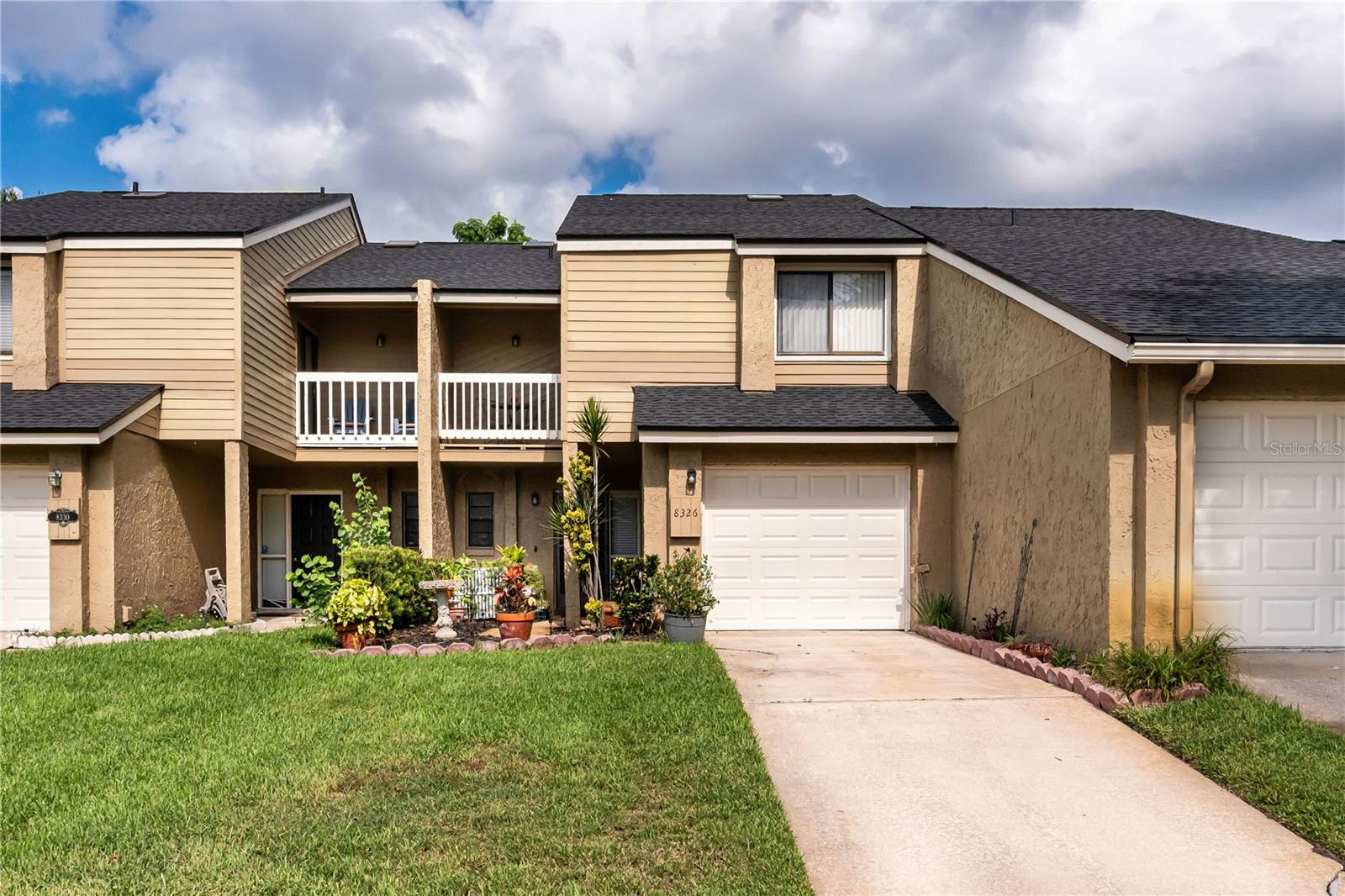 Expect to be impressed with this move-in ready townhome in Citrus Chase, a desirable Dr. Phillips community! Recent updates include: (1) NEW A/C and HEAT PUMP (2024), (2) NEW ROOF (2023), and (3) FRESH INTERIOR PAINT. Layout features open common living areas and half bath on ground floor with bedroom suites, flex room and full baths upstairs. Kitchen boasts breakfast bar, abundant cabinetry in trendy white tone, stainless appliances, and spacious closet pantry. There’s room for a bistro table here, or you can use the formal dining area as your gathering space for meals. Both the living and dining areas feature highly polished wood flooring and are bathed in light courtesy of the double set of sliding doors that provide access to the patio. Primary suite is upstairs in the front of the home. Bedroom is generous in size - room for sitting area or private desk. Your suite includes a walk-in closet, ensuite bath w/shower and a private balcony overlooking the neighborhood green. The second bedroom, also generous in size, is a suite w/ensuite bath. And there’s a bonus room that’s flexible to arrange as an office or even a third bedroom. Out back, you’ll enjoy an oversized patio – plenty of room to set up leisure furniture and a grilling station. A treed backyard gives you a bit of privacy while you enjoy your fun in the sun. Citrus Chase has a meticulously maintained amenity center with tennis courts and resort-style pool – and you are close enough to walk there. The HOA takes care of your lawn – makes life a bit easier! Excellent overall location – great school district, 5 minutes to essential shopping and dining along Sand Lake Rd., and about 10 minutes to I4/SR 528, giving you quick access to the greater Orlando area and the attractions. You'll love living here. Come see all that this special home has to offer.