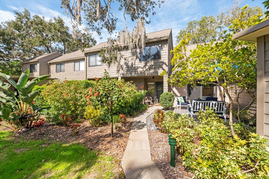 Pride of ownership shows in this renovated spacious 2 bedroom/3 bath treehouse with preserve views of Clower Creek where sightings of owls, egrets, and herons is common.  The kitchen has been updated and is open to the main living area enhancing the flow of the property’s layout.  The floorplan is spacious, allowing for versatile living arrangements and a seamless flow between rooms. Step outside to the back patio and be enchanted by the serene view, providing a tranquil retreat.  There is ample, designed storage space throughout this condo. Parking is in closest carport spot; lots of parking nearby for visitors/2nd car.  Pelican Cove is a 75-acre, gated waterfront community. Residents cannot only enjoy the lush tropical foliage but also take advantage of the 86-slip boat harbor with excellent rates (call HOA for availability), perfect for boating enthusiasts, as well as a launch dock for kayaks and canoes. The community offers an array of amenities, including six heated swimming pools, a hot-tub, three clubhouses, four lighted tennis courts, shuffleboard, basketball, a dog walk area, walking trails, and boardwalks. Enjoy the peaceful fishing gazebos or take part in water exercise classes and utilize the exercise facility. Don't miss the opportunity to experience the lifestyle in this meticulously upgraded condo, nestled in the heart of Pelican Cove's vibrant and amenity-rich community.