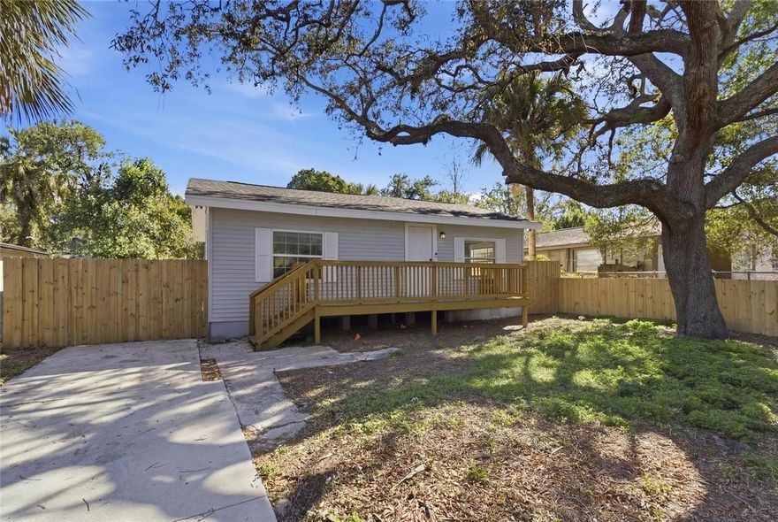 Welcome to this completely renovated 3 bedroom, 2 full bath home in Tampa, FL! Step inside to find new LVP flooring throughout and a beautifully updated kitchen featuring quartz countertops and stainless steel appliances. The renovated bathrooms include oversized spa-style bathtubs, along with in-unit laundry with a washer and dryer included. Enjoy the outdoors with a front deck, brand new fully fenced property, and a huge backyard—perfect for entertaining, pets, or future expansion. This home offers true peace of mind, having passed a clean 4-point inspection with all major mechanicals updated: Roof (2020), Electrical Panel (2022), HVAC (2019), and Water Heater (2016). Conveniently located near I-275, the Hillsborough River, Rogers Park Golf Course, and just 10 minutes from Downtown Tampa, this property delivers both comfort and accessibility. Recently appraised above list price, making it an excellent opportunity for a first-time homebuyer or an investor looking to add a solid property to their portfolio. Don’t miss your chance to own a move-in-ready home in a growing Tampa neighborhood!