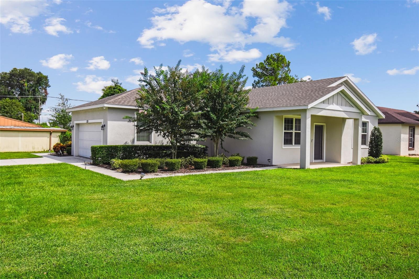Barely-used vacation home - Like New! Situated on a large corner lot in a quiet established neighborhood, just steps to the public boat ramp on Lake Howard, connecting to over 15 lakes! No HOA or CDD! Notable features include 9 ft. ceilings and luxury vinyl floors throughout; high end finishes, like solid surface countertops, solid wood cabinetry with one touch close. The spacious master suite boasts a sizable walk-in closet, en-suite bathroom with double sinks, shower & linen closet. Great location - just minutes to Winter Haven's charming downtown district, as well as central to all Florida has to offer. (Home can be purchased furnished if you so desire.)