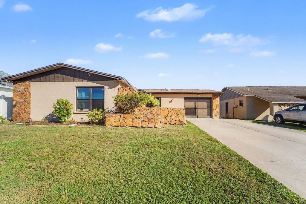 Photo of 8431 Redfield Drive, Port Richey, FL 34668 (MLS # TB8559340)