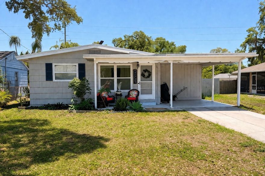 Welcome home to this beautifully updated 3 bedroom 2 bathroom home perfectly located in a highly desirable, golf cart-friendly neighborhood. Offering comfort, style and convenience, this home is just approximately 8 blocks from vibrant Edgewater Drive & Intercoastal water and only three blocks from the scenic Pinellas Trail. Ideal for biking, walking, or enjoying the outdoors. Step inside to discover a brand new kitchen that serves as the heart of the home. Featuring creamy white cabinets with elegant gold handles and stunning quartzite countertops in a soft off white tone. Subtle, gorgeous countertops have elegant neutral veining this kitchen is bright, modern and perfect for everyday living. Both bathrooms have been tastefully renovated with one offering a relaxing walk in jacuzzi tub with built in seat. The thoughtful layout provides cozy living space with natural light and open feel. Outside, enjoy savings with solar power system featuring solar panels installed on a brand new durable metal roof, (with a flat rolled roofing section) A TESLA Powerwall 3.This setup provides reliable backup power and reduced Duke electric bills. Solar panels are on a lease and will need to be assumed at closing.  Also, enjoy the convenience of a spacious carport that comfortably fits your car or golf cart, a huge plus in this community where golf carts are a way of life. Nearby, you'll find local vegetable markets, Natures Food Patch, charming restaurants, and easy access to everything the area has to offer. This updated home delivers Florida living at it's best. Recap: New Metal Roof, New Kitchen cabinets with quartzite counter tops, New Air Handler, with new duct work, new flat rolled roof over portion of home, Tesla Power Wall, remodeled bathroom with walk in bath tub. Natural gas meter at house.