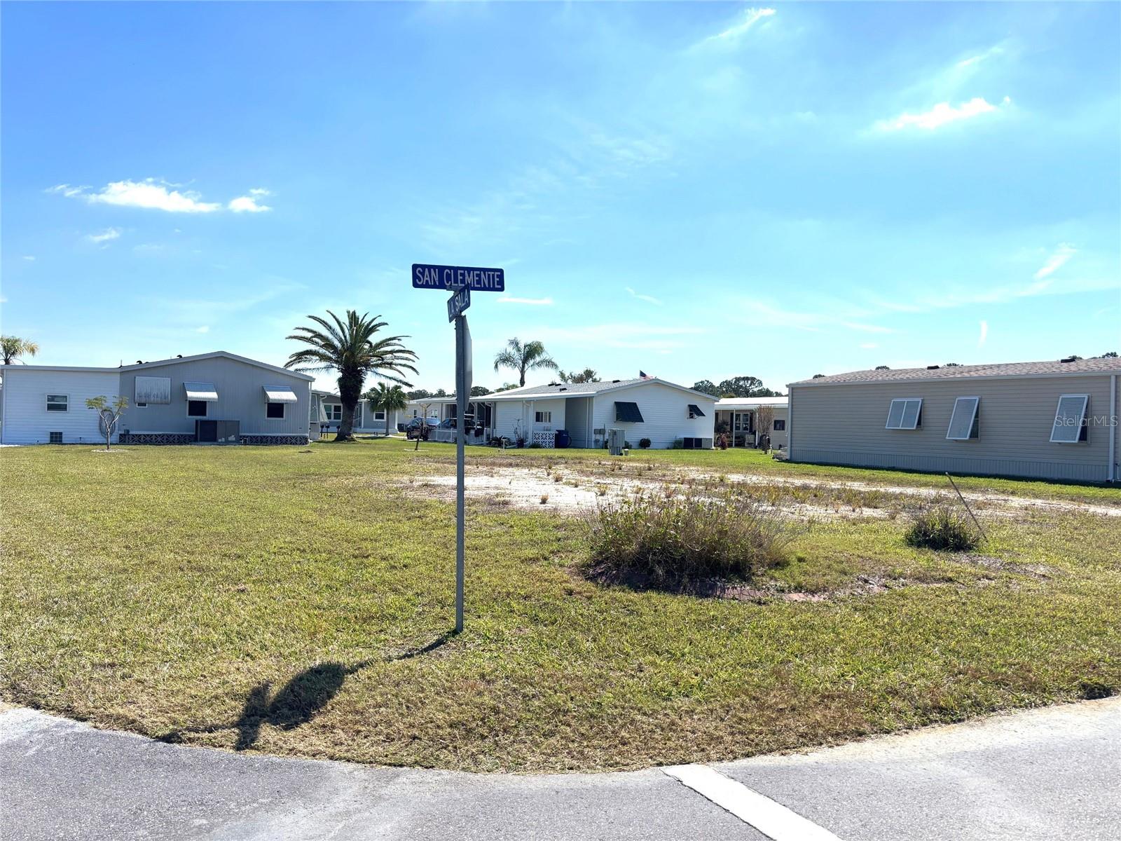 Vacant lot in a vibrant 55+ community! La Casa offers the ultimate Florida lifestyle. We have 974 homes nestled among a variety of native trees with spacious common grounds surrounding our eight lakes. Located between Sarasota and Fort Myers, this is a boater's dream with access to the Gulf of Mexico. It is convenient for shopping, sightseeing, golfing, fishing, and boating, as well as all the culture and elegance the Southwest Florida area is noted for. La Casa may have the best pools in the area. Our crown jewel is an extremely large, 40 X 60-foot swimming pool that is kept at a perfect 87 degrees. Our smaller 20 x 40 pool is quietly nestled between the clubhouse and the Activity Building. Both pools have adjacent hot tubs which are ideal for soaking muscles that are tired from golfing or tennis. Wireless Internet (Wi-Fi) is available at the Clubhouse, Activity Building, and Recreation Hall area where these pools & spas are located, so you can catch some rays while you catch up on your email! Sound enticing? Come for a visit to this self-contained oasis and see for yourself why La Casa is the ultimate destination for both snowbirds and year-round residents!