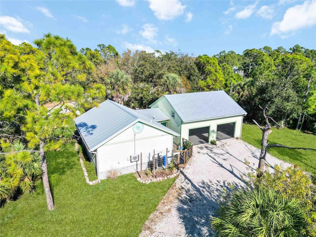 Photo of 7348 Coach Road, Port Charlotte, FL 33981 (MLS # C7521816)