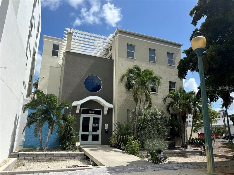 Look at this great location Downtown Sarasota. Walk to everything. This commercial building is 3 floors with spa lounge on 1 & 2. Top floor with private elevator is the penthouse condo. This 4 bedroom is very unique with a very open floor plan and high ceilings. The kitchen has huge workable island, wine fridge, built in oven and microwave, 6 burner gas top with grilling area. A separate full length wet bar/ coffee station with 2 dishwashers and many cabinets for storage. The open concept space of dinning and living room with a non burning fire place is very soothing. long upper and lower windows and sliders lead out to a open patio balcony off the kitchen that views the city and Shelby Library. This is a great space to grill up for all your friends. The master bedroom has a delightful walk through closet / storage that leads to a nice size master bathroom with huge walk in shower. Through out the unit all rooms have very nice lighting from windows ceilings to floor. A spiral staircase takes you to the third upper floor bedroom with a 1/2 bath and it's own rooftop patio. This unit comes with two assigned covered parking spaces and guest parking lot if needed. This is a must see unit in the heart of Downtown Sarasota. Off Season 1 month min at $6200 includes all utilities, prime season Dec to April $8500 per month includes all utilities