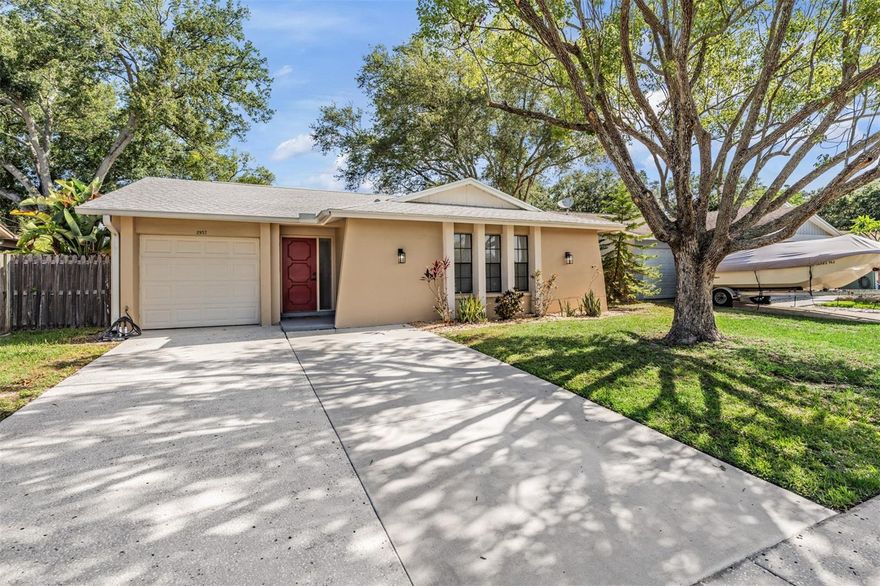 Perfectly positioned in the heart of Palm Harbor, this bright and beautifully maintained 2BR/2BA single-family block home offers the ideal blend of comfort, convenience, and Florida lifestyle living — all with NO HOA and located in a NO FLOOD ZONE. Move-in ready and filled with natural light, this inviting home is just minutes from world-class beaches, championship golf, shopping, dining, and the renowned Innisbrook Resort. Inside, you’ll find an airy open-concept layout designed for easy everyday living and entertaining, featuring tile and luxury vinyl flooring throughout with carpet in one bedroom. The spacious living and dining areas flow seamlessly through French doors to the outdoor living space, creating the perfect indoor-outdoor feel. The kitchen is both functional and stylish with granite countertops, abundant cabinetry, and a charming eat-in dining space. The private primary suite offers a beautifully updated en-suite bath complete with a glass walk-in shower and modern vanity, while the second bedroom sits adjacent to an updated guest bath with a newer vanity and tub/shower combination. Step outside and enjoy true Florida living with a covered and screened lanai, open patio area, and FULLY FENCED backyard — ideal for entertaining guests, pets, or simply enjoying peaceful mornings outdoors. Whether you're looking for a full-time residence, seasonal retreat, or investment opportunity, this property checks every box with excellent flexibility and strong rental potential. Short-term and annual rentals are permitted, and there is even an option to purchase fully furnished for a truly turnkey experience. Conveniently located just 15 minutes from the beach, 30 minutes to Tampa International Airport, and 35 minutes to vibrant downtown St. Petersburg, this Palm Harbor gem delivers location, lifestyle, and value all in one.