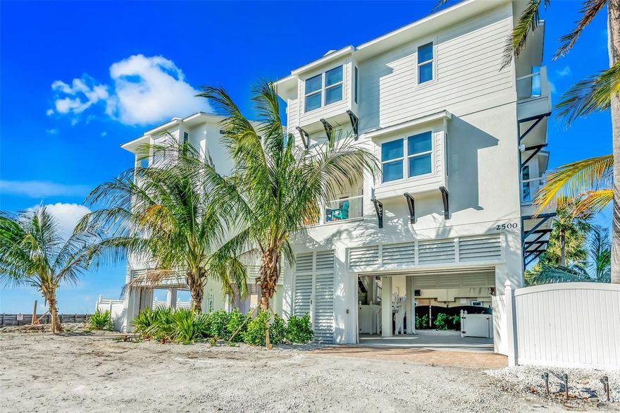 ~HUGE PRICE ADJUSTMENT...BEACHFRONT LIVING & one-of-a-kind views from every room in this truly unique property on Anna Maria Island! Completely remodeled & renovated in 2022 this beautiful home features 5 bedrooms & 5 bathrooms, plus 2 half baths and can very comfortably sleep up to 16 guests. The main living area faces the Gulf along with the kitchen and dining room creating a spacious open feel, the view is truly incredible. The kitchen was nicely designed with custom mosaic backsplash, granite countertops along with luxury appliances including a commercial grade gas range. Enjoy the sounds of crashing waves from the eat in kitchen. The living room also has a dry bar with wine cooler perfect to entertain family and friends. 
The 5 en-suite bedrooms each have their own private balconies and more gorgeous views to step away and have morning coffee or evening cocktails. There are two fun bunk rooms; one even features a fantastic game room that has ample space for the whole family to come together and enjoy. The incredible outdoor living area is the winner for everyone. Enjoy the mini basketball court, time relaxing in the spa and pool, lounging by the tropical landscaping and turf, and how about AMI's pristine powder sand beach right in your backyard. This island gem is conveniently located in Bradenton Beach right in the middle of both bridges for easy access on and off the island. What makes this property extra unique is that there are no neighbors to the south of the property, so you have unobstructed views of Anna Maria's stunning sunsets every night. Offered turnkey furnished, come make this home your forever BEACH HOUSE RETREAT or use it as an income producing vacation rental.