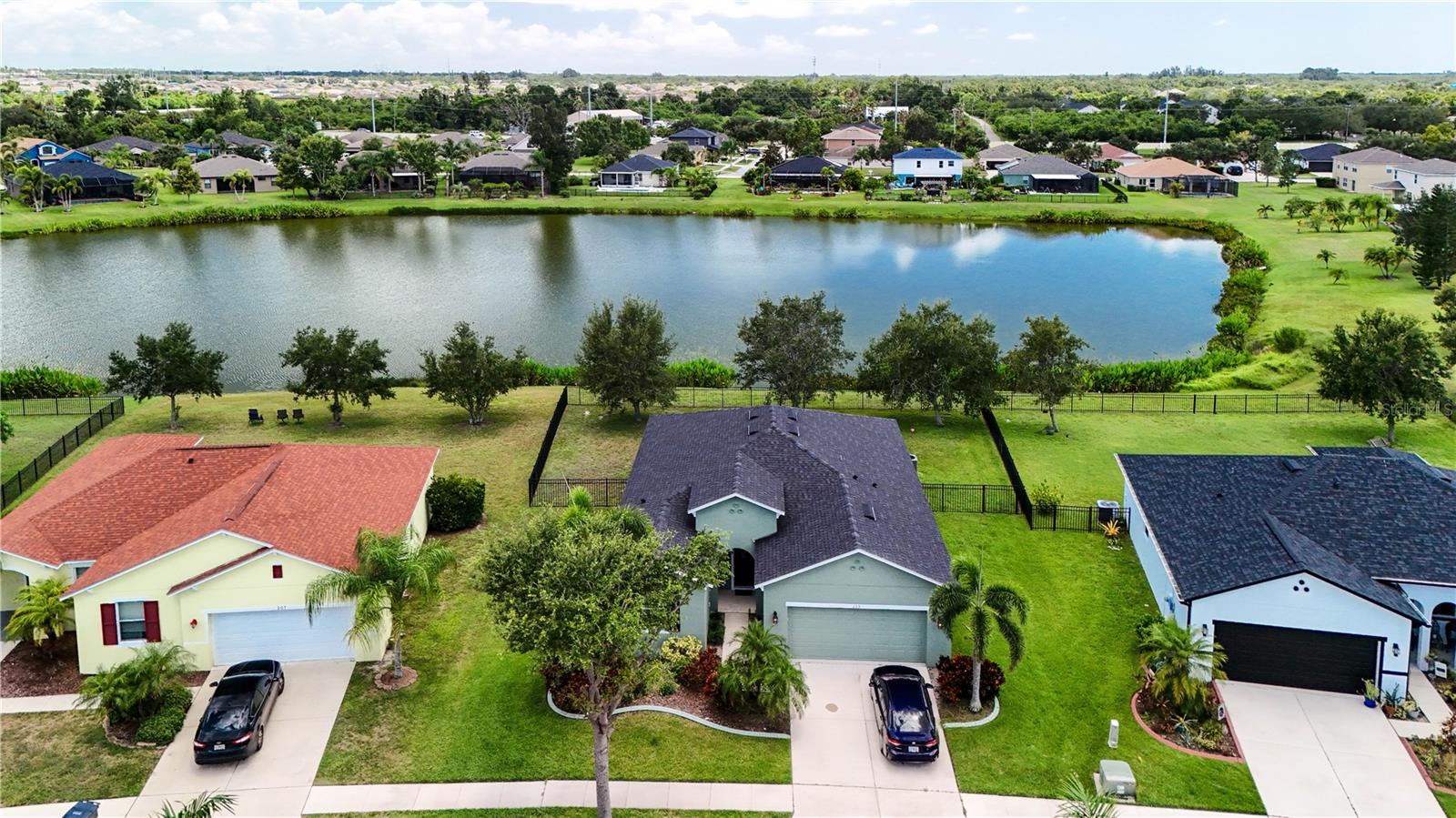 Welcome to this beautifully maintained 3-bedroom, 2 bathroom home with a two-car garage in the heart of Apollo Beach. There is a fourth room (currently used as an office) that could be a bedroom - the closet was installed by the builder when new, but the home is reflected as only being three bedrooms. Sitting on a 75' wide lot with 87' ft of water frontage, you have plenty of yard space to stretch out! This home boasts nearly 2000 sq ft of living space with a desireable open floor plan which makes it feel even larger. It features updated flooring and serene pond views! All major updates have been take care of for you: new roof (2021), HVAC (2021), and all appliances have been replaced within the last four years. Located in a friendly community with a pool, playground, basketball court, fitness center, walking trails with multiple gazebos, as well as RV storage. The HOA fee is surprisingly low at only $105 per year. Other communities with similar amenities are much higher! You are close to shopping and recreation as well. This home truly has everything you are looking for. Make an appointment to come see it today! *All room sizes and lot dimensions are estimated and should be verified by buyer.*
