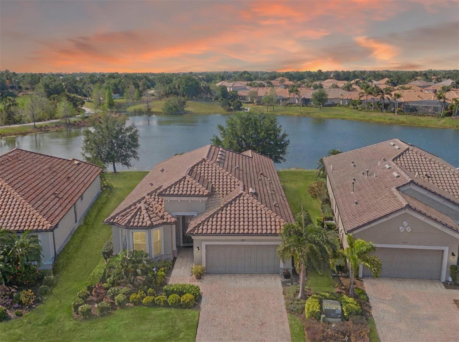 One or more photo(s) has been virtually staged. BACK ON MARKET...with a PRICE IMPROVEMENT! The buyer’s circumstances changed so their Loss is Your Gain! NOW $739,000!
Live the resort lifestyle in this beautifully enhanced Piceno model by Taylor Morrison, located in the gated Esplanade Golf & Country Club at Lakewood Ranch. This move-in-ready home offers timeless style, thoughtful upgrades, and a peaceful retreat in one of the area’s most sought-after communities. Perfectly positioned on a premium lot with tranquil views, the home features 2 bedrooms + den, 2 bathrooms, and over 1,900 sq ft of elegant, open living space. Step inside and discover rich Mirage Aged Maple hardwood floors, custom wood plantation shutters, seven designer ceiling fans, and custom built-in closets throughout. The open-concept kitchen is ideal for everyday living and entertaining, featuring a one-piece granite countertop, new sink and faucet (2023), new refrigerator (2023), and new microwave, dishwasher, and disposal (2024). The expansive island, upgraded cabinetry, and under-cabinet lighting complete this stylish and functional chef’s space. The primary suite is your private retreat, with a pocket door for added privacy, custom closets, and a spa-like bathroom featuring updated counters and sinks (2020), a large walk-in shower with a new surround (2021). The guest suite also includes a pocket door and updated finishes, with a guest bathroom just off the suite that has and a soaking tub and shower combo and vanity, offering your guests comfort and privacy. The den is currently being used as a formal dining room, but this space can also be used as a den with sitting area and TV, an office space, or even a 3rd bedroom. Step outside to your expanded screened paver patio, designed for true Florida living. A summer kitchen (2014), custom feature wall (2015), and peaceful garden views make this the perfect space for morning coffee, al fresco dining, or evenings by the outdoor fireplace when the breeze rolls in. Additional highlights include: New A/C (2024) | Retired Stewardship Bond (2016) | 4-ft garage extension with custom built-in cabinets (2015) | Water conditioner rebuild (2024) Sellers have a passing 4-point inspection they had completed March 28th 2025 available. As an Esplanade homeowner, enjoy access to resort-style amenities including golf, tennis, pickleball, three pools, a full-service spa, culinary center, fitness centers, clubhouse dining, the Barrel House Bistro, and poolside drinks at the Bahama Bar. Please note: this is not a golf-deeded home. Located just minutes from Lakewood Ranch Main Street, University Town Center, and Florida’s award-winning Gulf beaches.
This home offers the perfect blend of luxury, comfort, and the Esplanade lifestyle — schedule your private showing today!