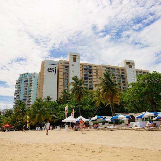 Discover an exceptional turnkey investment opportunity in the heart of Isla Verde! This charming studio unit, located on the 1st floor of the renowned ESJ Towers Condo-Hotel, offers 472.50 sq. ft. of interior space plus 243.83 sq. ft. of open court area, for a total of 716.33 sq. ft. of usable space. The unit is completely furnished and sold with all appliances, making it move-in or rental ready from day one. Ideally located less than 2 minutes from Luis Muñoz MarÃn International Airport and adjacent to the iconic Fairmont El San Juan Hotel, this property offers unbeatable accessibility and vibrancy. A variety of restaurants, pharmacies, and supermarkets—many open 24/7—are within walking distance. You're just 8 minutes from The Mall of San Juan and 10 minutes from the historic charm of Old San Juan. Residents and guests enjoy direct, private access to Isla Verde Beach, ranked by USA Today as the #1 urban beach in 2016 for its beauty and convenience. ESJ Towers offers top-tier amenities including 24/7 security, front desk service, a modern gym, game room, coffee shop, and a stylish lobby with bar and lounge. The pool is currently scheduled for renovation, adding even more appeal to this already desirable property. With a monthly HOA of $512 (which includes water), annual hazard insurance of $1,272.12, and CRIM property taxes $1,524.44 . This turnkey studio is a fantastic opportunity for investors seeking consistent short-term rental income in one of Puerto Rico’s most sought-after destinations.