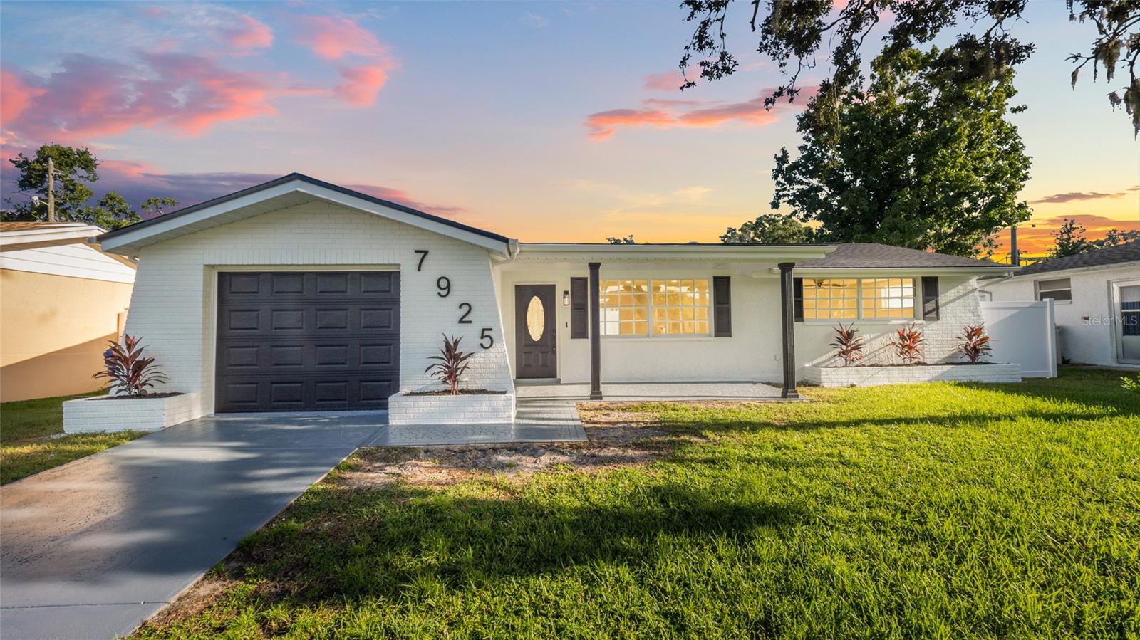 Welcome to the new house of your dreams! ~ Located in a great neighborhood Magnolia Valley in New Port Richey Florida! Improvements that have been made to ensure your maximum comfort and satisfaction. Let's start with the essentials. Inside, you'll find a plethora of features that will really impress you. The kitchen has been transformed with stunning new cabinets, quartz countertops, sleek elegant backsplash and NEW appliances complemented by new luxury vinyl flooring and baseboards that runs throughout the home. Each room exudes a fresh vibe thanks to fresh new interior paint. This property offers spacious 3-bedroom, 2-bathroom totaling 1,325 square feet of living area. Improved LED lighted, Freshly painted Interior and Exterior, New roof(2025), New Water Heater (2025), and the modern vinyl fence(2025), driveway in front provides convenient parking. Spacious backyard with lanai room for outdoor activities. Conveniently located near to New Port Richey Downtown, shopping center, dining, and major roadways, this home is full of potential—don't miss your chance to make it yours!