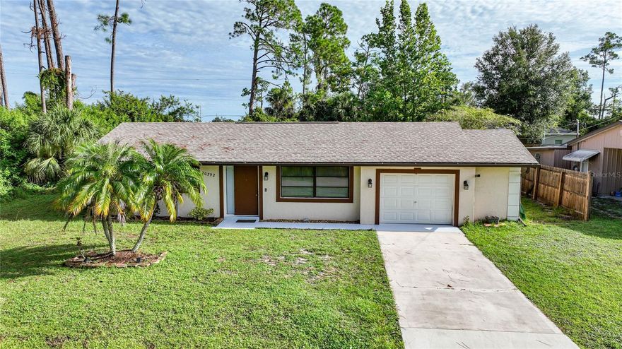 Indulge in the perfect combination of convenience and security with this delightful home. Crafted with sturdy BLOCK construction and featuring an inviting inground swimming pool, it offers a sense of safety and tranquility. The backyard is thoughtfully fenced, and an added baby barrier around the pool ensures an extra layer of protection.  Benefit from the added advantage of being located OUT OF THE FLOOD ZONE, which not only provides peace of mind but also translates to substantial savings.  This home is located in a quaint neighborhood with public water and sewer already hooked up. Step inside to discover two charming bedrooms on the left side of the house, each with vinyl plank flooring. The spacious living room opens up to the well-appointed kitchen, complete with wood cabinets, granite counters, stylish stone backsplash and eat in area. An adjoining flex space presents versatile opportunities to create a family room, dining area, office, playroom, or any space tailored to your needs. Although the garage may initially seem like a one-car size, it pleasantly surprises with ample space comparable to a two-car garage (19x19). Adjacent to the garage, the laundry room awaits, with the potential to be closed in with AC for enhanced comfort. Additional storage is available in the backyard with a sizable 10x20 shed, perfect for accommodating all your belongings and more. Enjoy precious moments with your beloved pets and children in the secure backyard, offering an ideal space for them to play and explore worry-free. For families with young children, the pleasure of walking them to school awaits, as a school is conveniently located around the corner. Recent upgrades include a NEW ROOF in 2020, along with a replaced electric panel and a new water heater, ensuring the home is equipped with modern amenities. This home promises to be a haven of comfort and convenience, making it the perfect choice for those seeking a harmonious blend of safety and contentment.