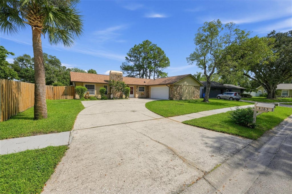 Photo of 4165 Rolling Springs Drive, Tampa, FL 33624 (MLS # O6443748)