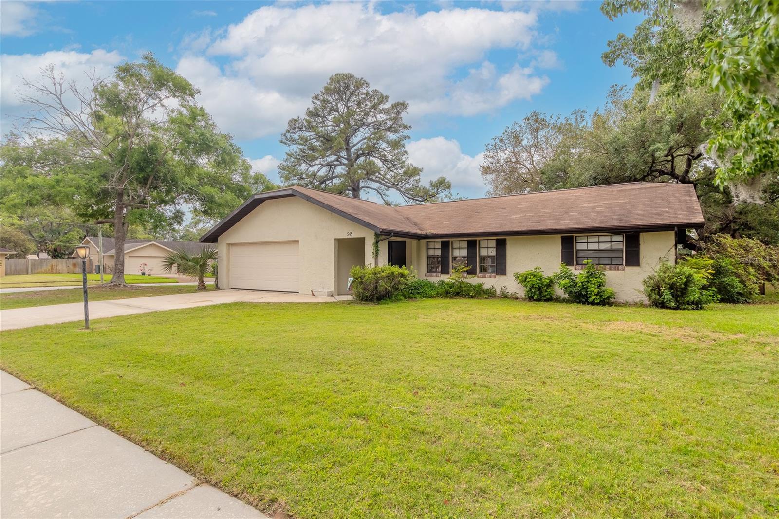 This ranch-style home located in The Hamlet in Port Orange has great potential, especially with its convenient location and desirable features like a two-car garage, corner lot, and large fenced yard. The fact that it needs some tender loving care (TLC) suggests that there are opportunities for renovation and personalization. With some attention and investment, you could transform it into a beautiful and comfortable space. 3 bedroom, 2 bath, 2 car garage with huge fenced yard is ready for your personal touch. New AC in 2023.