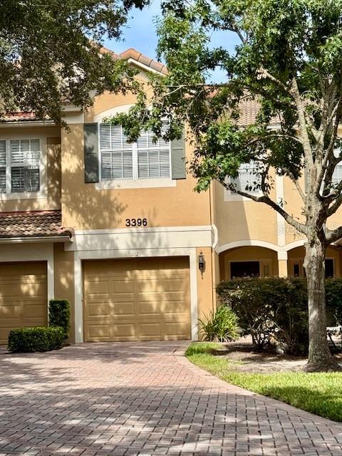 Elegant two-story townhome, features a tile roof, extended paver driveway and upgraded interiors. The floorplan offers 3 Bedrooms and 2.5 bathrooms with a 1 car garage is ready for a new family. This design welcomes you with beautiful trim and molding throughout foyer and staircase. Spacious living/dining room great for entertaining with a screened porch. The entire 1st floor is tiled and the kitchen features 42? cabinets, granite countertops and all kitchen appliances are included. All bedrooms are upstairs and master suite features tub/shower with spacious walk-in closet. LOCATED IN DESIRABLE STONEBRIDGE LAKES, A GATED COMMUNITY AT METROWEST. 24 HOURS VIRTUALLY GUARDED. CLOSE TO THEME PARKS, MALLS AND QUICK ACCESS TO MAYOR HWYS.