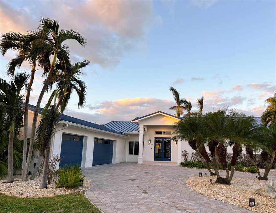 Beautiful property with more than a quarter acre, corner lot with 187' of water frontage. New seawall 2005 and pool. Two boat docks with boat lift. Located in the Emerald Harbor community.