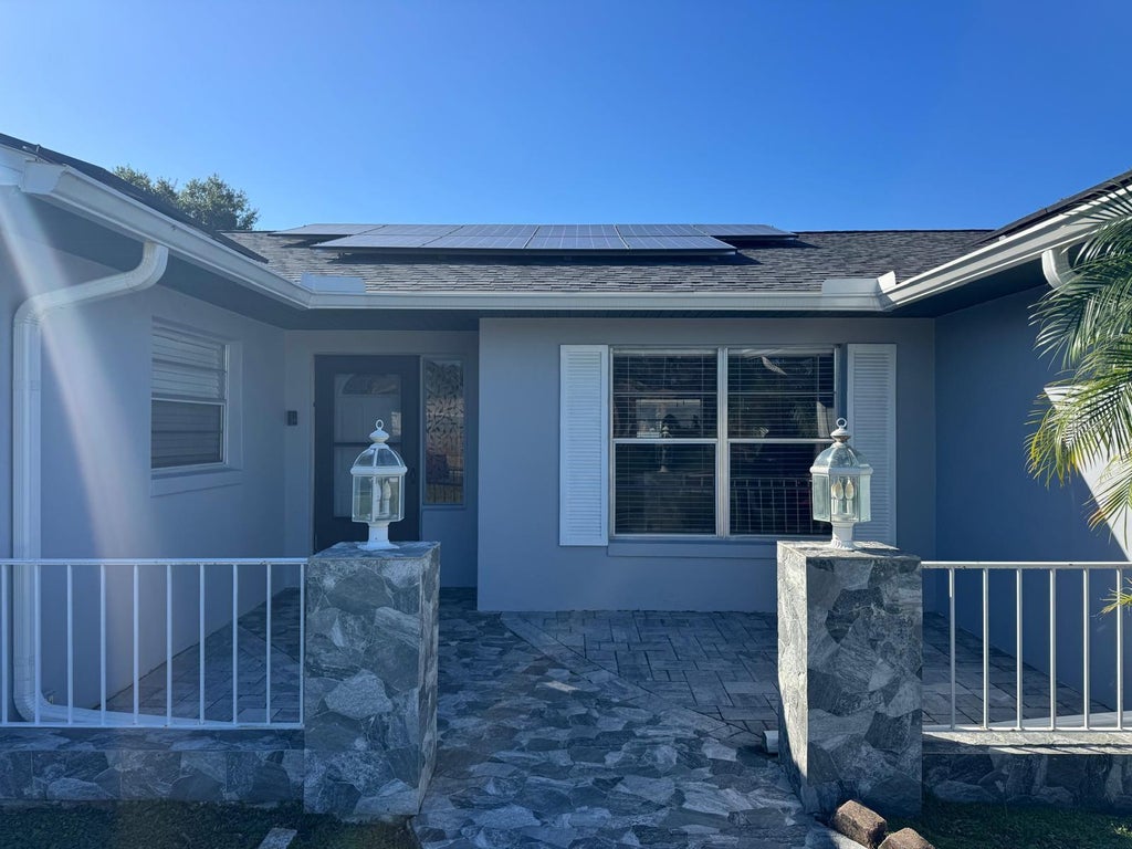 Photo of 1814 Paradise Drive, Kissimmee, FL 34741 (MLS # O6451465)