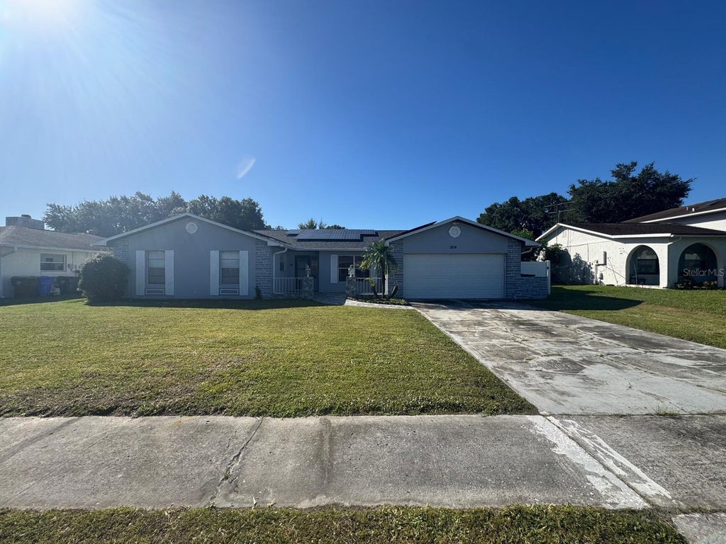 Photo of 1814 Paradise Drive, Kissimmee, FL 34741 (MLS # O6451465)