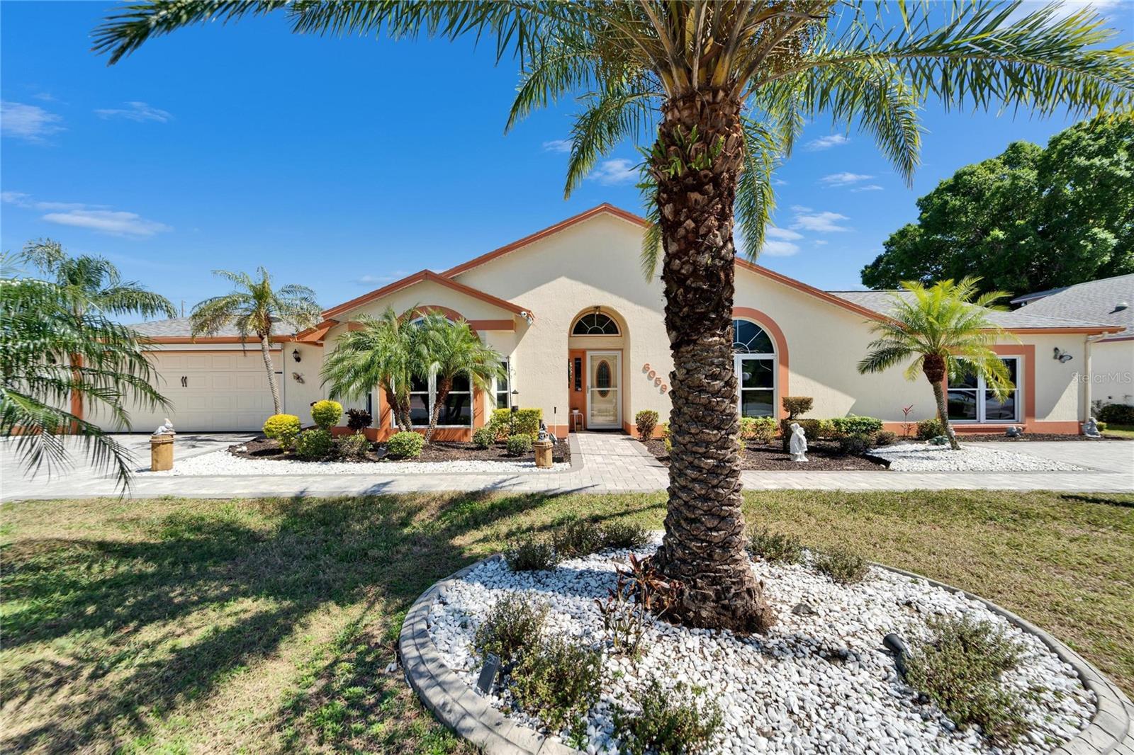 Welcome to your dream home at Sandpiper Golf & Country Club, one of the largest and most impressive residences in the community. Featuring three spacious bedrooms plus a versatile bonus room — perfect as a fourth bedroom, in-law suite, or family retreat — this home offers unmatched flexibility and comfort. The primary suite boasts two expansive his-and-her walk-in closets, providing ample storage for your lifestyle needs.
Enjoy peace of mind with a host of recent upgrades, including a new roof (2021), water heater (2022), and fresh exterior paint (2021). State-of-the-art smart appliances turn everyday tasks into effortless routines, while the two paver driveways comfortably accommodate up to eight vehicles or an RV, complete with a 30-amp hookup for your convenience. Safety and security are paramount, with professionally installed security cameras, smart locks, and updated storm and front doors (2021).
Relax and entertain on the stunning 28-foot lanai with double doors leading to the golf cart parking area, all outside seamless gutters ensure impeccable curb appeal. Interior upgrades abound — brand new outlets, switches, door handles, shelves, ceiling fans, carpets (2019), and a central vacuum system elevate this home to a new level of luxury.
The spacious 900-square-foot, air-conditioned garage offers ample room for your vehicles and storage needs. Indulge in resort-style amenities with a low monthly HOA fee of just $150, including high-speed internet, cable, lawn care, and access to upscale clubhouses, heated pools, sports courts, a fitness center, on-site golf with a pro shop, and a restaurant/bar. Join numerous organized events and activities designed for an active and engaging lifestyle.
Nestled just one mile from I-4, this ideally located community puts shopping, medical facilities, Gulf and Atlantic beaches, and major airports in Tampa and Orlando within easy reach. Enjoy the exquisite amenities of Sandpiper Golf & Country Club: golf, six lighted pickleball courts, two tennis courts, and a central clubhouse with pools, hot tub, billiards, gym, and more. The exclusive recreation center offers ping pong, additional pools, and sports courts.
Discover a vibrant community full of activities — shuffleboard, cornhole, horseshoes, library, bingo, bus trips, group cruises, dances, and special events at the Links Restaurant. Located in Lakeland, FL, halfway between Tampa and Orlando, with quick access to I-4 and top attractions like Disney, Universal, and Busch Gardens — this is more than a home; it’s your personal paradise.
Don’t miss the opportunity to own a property in an award-winning community, recognized as the Choice for Best Retirement Community in Polk County by The Ledger. Schedule your showing today and make your dreams a reality!