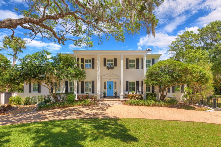 Discover this Stunning Estate perched on over half an acre in Ormond Beach ( the Adjacent 1/2 acre vacant lot is available with the sale of the home thru additional negotiations). Nestled on the sought after oak-lined one-way street in the heart of Ormond's beachside community. This home sits just 2 blocks to the Atlantic Ocean, steps to the Halifax River, and a stone's throw from The Casements, (what was Rockefeller's summer retreat, now affectionately called the ''Jewel of Ormond Beach''). Relative updates and features: Concrete Block Construction, Re-Roof in 2021, Gutters, Rear Porch addition 2022, Pool 2019, & HVAC 2021. The home effortlessly exudes a warm and welcoming atmosphere throughout, offering nearly 5,000 square feet of premier living. As you step inside, you're greeted by a grand foyer that leads to spacious living areas, where natural light floods through the wall of windows. Five bedrooms and five bathrooms, including three en-suites, provide ample space and privacy. The ground floor suite with private entrance, is the perfect flex space, providing opportunity for an additional Entertainment Room, Guest Room, In-Law Suite or Home Office. The Oversized 3 car Garage includes a huge workshop area, as well as a massive 16 x 26 storage room. Upstairs, The kitchen and the adjacent Family room provide open concept living, complimented by an expansive island and dining nook.  Bask in the backyard outdoor oasis surrounded by lush landscaping and enjoy the perfect blend of Coastal Living and the Florida Lifestyle. The covered back porch overlooks the entire outdoor entertaining space. Featuring a summer kitchen, dining area, gas fire pit, and the pool. This unique property seamlessly blends timeless elegance with modern convenience. Whether you're looking to create lasting memories with family or entertain in style, this gem provides an unparalleled lifestyle along with Ormond Beach's rich history, making it a truly exceptional find.  All information intended to be correct and accurate, is not guaranteed, taken from public records.