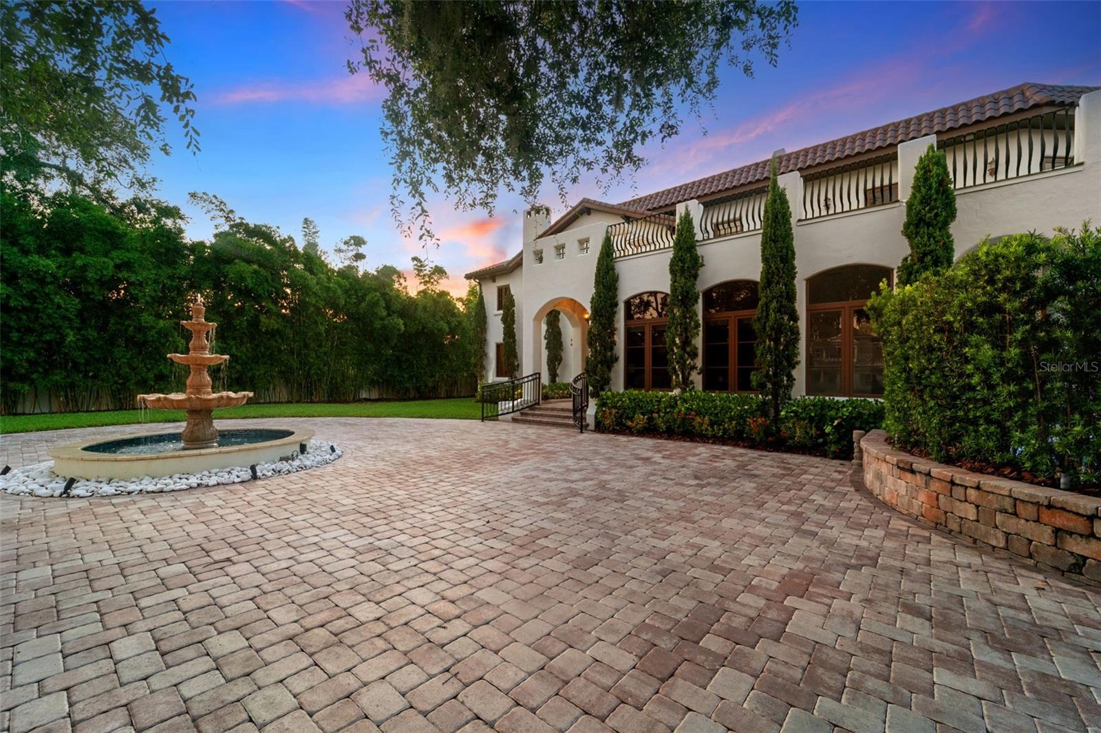 One or more photo(s) has been virtually staged. Welcome to 4555 W Swann Avenue—a showstopping Mediterranean estate nestled in Tampa’s prestigious Beach Park neighborhood. Built in 1925 and exquisitely renovated, this architectural masterpiece blends historic charm with unmatched modern sophistication.
Situated on an oversized lot behind a gated circular drive with a centerpiece fountain, this home offers over 6,800 square feet of resort-style living. The home boasts 5 bedrooms, 6 full baths, multiple living spaces, and both upstairs and downstairs laundry rooms for optimal convenience.
The 1,000+ sq ft primary suite is a true retreat, complete with a private sitting area, fireplace, wet bar, dual designer closets—including a custom purple-glam dressing room—and a spa-inspired bathroom with statement soaking tub, makeup vanity, and expansive walk-through shower.
Step outside to your private paradise: a luxury pool with a cascading waterfall, glowing iridescent tiles, and ambient lighting, all framed by tropical landscaping and a mosquito misting system. Entertain in the fully equipped outdoor kitchen, or unwind on the 1,500 sq ft turfed balcony that seamlessly extends your living space outdoors.
The turfed side/back yard is packed with family-friendly luxury, featuring an in-ground trampoline, putting green with lighted holes, a dog run, and a custom cat cave—a whimsical and functional retreat for your feline family member.
Inside, the chef’s kitchen stuns with dual-tone custom cabinetry, a massive center island, walk-in pantry, and high-end appliances. The open-concept living and dining area is anchored by arched windows and flooded with natural light. Additional highlights include a 700-bottle wine cellar, large downstairs en-suite guest bedroom, bonus room, and multiple living spaces with fireplaces and custom millwork.
Located in a top-rated school district and designed for both everyday living and grand entertaining, this home also features a transferrable roof warranty and has had no flooding or hurricane damage (Milton or Helene).
Experience the ultimate in design, functionality, and location—just minutes from Westshore, Hyde Park, Tampa International Airport, and the city’s finest shopping and dining.