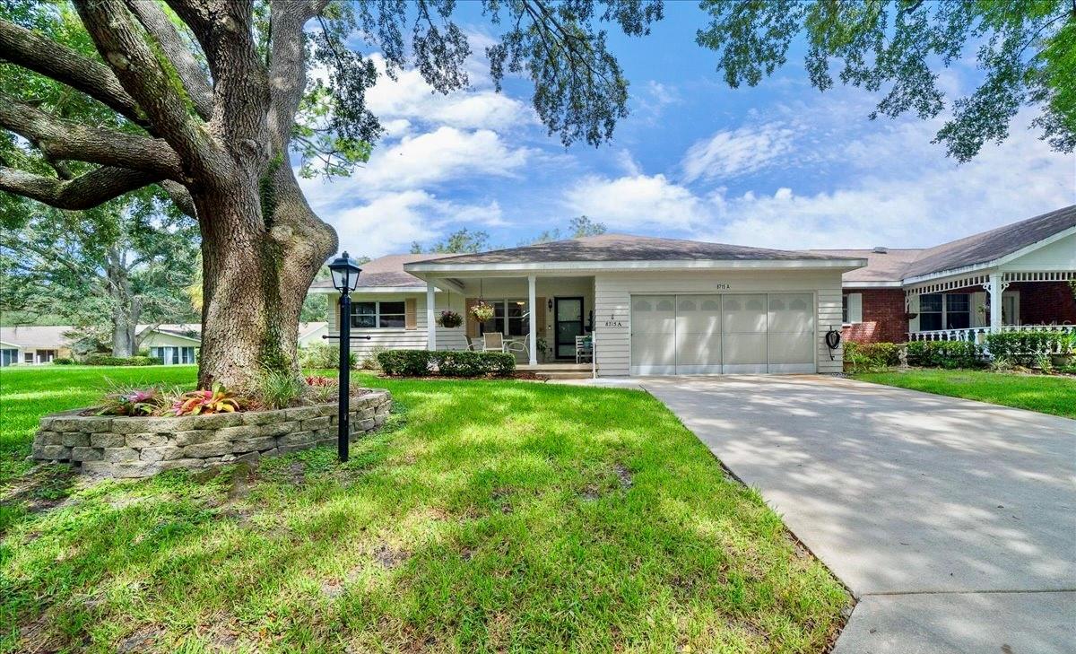 Located in the highly desirable 55+ gated community of On Top of the World, this spacious 2-bedroom, 2-bath end-unit villa offers 1,748 sq.ft. of living space and a 2-car garage. This home is thoughtfully updated for both comfort and peace of mind, featuring a New roof (2018), New HVAC system (2021)and a one-year home warranty at closing. The open and inviting floor plan is enhanced by newer laminate flooring, natural light throughout and a bright kitchen offering abundant cabinet/counter space, cooking island, pantry and solar tube, making cooking and entertaining a delight. Florida room of the dining room fully under heat and air, adds versatile living space for year-round enjoyment whether relaxing with a book, hosting friends or enjoying morning coffee. Large primary suite offers a walk-in closet and spacious tile walk-in shower, while the second bedroom and bathroom provide comfort for guests or family. The 2- car garage is under heat & air, has a utility sink and plenty of room for storage or a golf cart. The community is golf cart accessible to nearby stores, shopping and restaurants, making errands and outings convenient. As a resident of On Top of the World you have full access to multiple golf courses,pools, pickleball courts, tennis courts, bocce, shuffleboard and over 20 miles of walking and biking trails. With 4 fitness centers, 4 dog parks, multiple gardens, and over 175 active clubs and activities, there is truly something for everyone. This home combines modern updates, thoughtful design, and resort-style living in one of Ocala’s most sought-after 55+ communities. Schedule your private showing today before it’s too late!