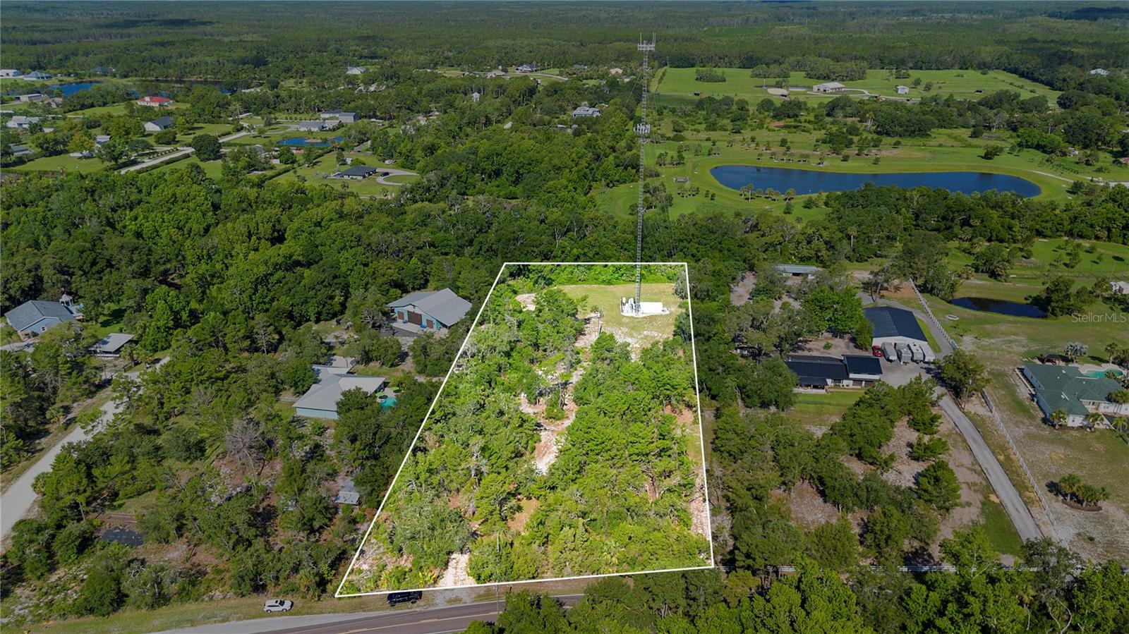 Rare opportunity in New Smyrna Beach! This 3.14-acre parcel is high, dry, and ready for your dream home, mini-farm, or investment. Zoned A-3, the land is mostly cleared with electricity on the property. A cell tower sits at the southern end with a 30-ft easement; the lease was paid out in full to the previous owner—NO income or obligations for the current owner, and at least 2 acres remain fully buildable. A right-of-way easement is in place and can be moved to suit your development plans. Beehives on the property provide agricultural tax savings and may stay or go. No HOA, no flood zone, and minutes to the beach, shopping, and I-95. Private, flexible, and full of potential! Giving you the freedom to park RVs, build barns or workshops, and enjoy flexible land use without restrictions. Call to schedule your private tour, walk the land and see the possibilities.