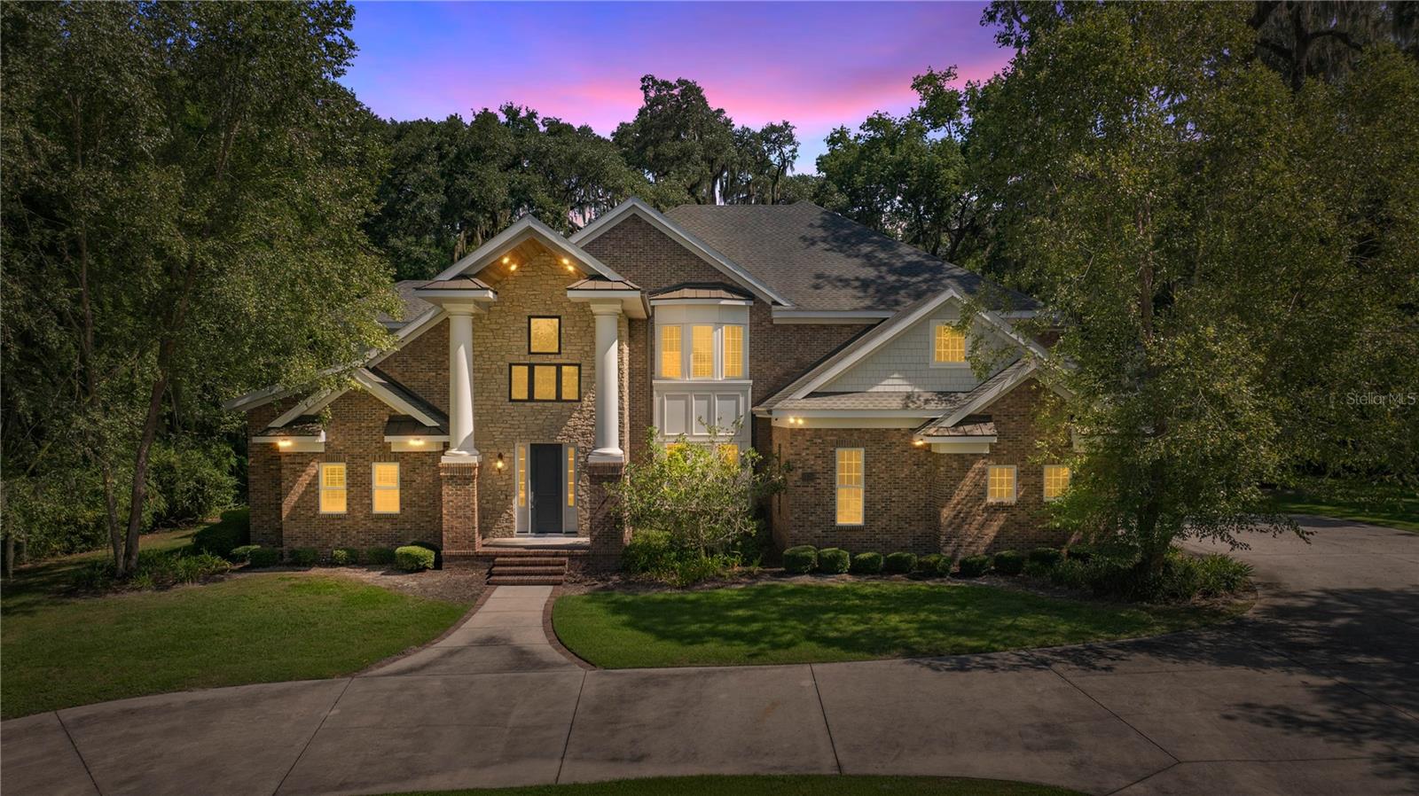 Magnificent 2 story custom home in the heart of Ocala! Located just a block outside of the Historic District, this 2015 home is truly a statement. The grand, 2 story foyer with a custom wood stair case, sets the tone for the elegance and functionality this home offers. The stunning bricked arches lead into the Chef's kitchen with Cambria Quartz countertops, Thermador appliances, maple cabinets and tons of counter space and storage. The downstairs Owner's Suite Wing is nothing short of breathtaking. The vast closest has plenty of space with CUSTOM CLOSET SYSTEMS and an island with Quartz counters. The Owner's bedroom and bathroom and beautifully laid out and are closed off from the rest of the home. One of the most impressive of the many features this home has is the nearly 1,000 square foot, 2 story bonus room. Complete with a 2nd story balcony overlooking the room, a massive 2 sided fireplace and large custom bar, it is ideal for large gatherings. Upstairs, there is a secondary Owner's Suite with shower and tub as well as a large walk-in closet with custom closets. The other 2 bedrooms share a Jack and Jill bath. One of the bedrooms could also be an upstairs bonus room. There is an oversized 2 car garage and an additional garage for larger vehicle storage. The home has 2 new gas tankless hot water heaters, 2 newer GENERAC generators, one for upstairs and one for downstairs, a whole house water filtration system, Andersen Windows, alarm system, SPRAY FOAM insulation and the list keeps going. A truly one of a kind in a truly one of a kind area!