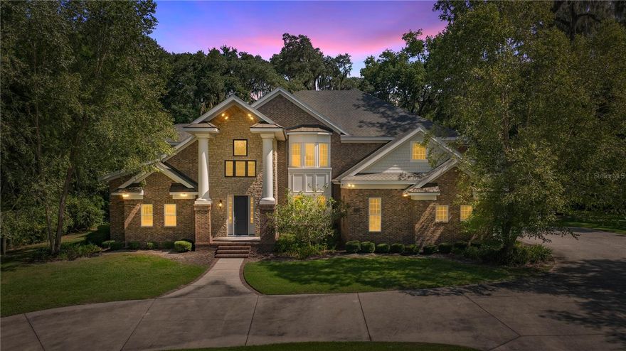 Magnificent 2 story custom home in the heart of Ocala with NO HOA! Located just a block outside of the Historic District and just minutes from hospitals and shopping, this 2015 home is truly a statement. The grand, 2 story foyer with a custom wood stair case, sets the tone for the elegance and functionality this home offers. The stunning bricked arches lead into the Chef's kitchen with Cambria Quartz countertops, Thermador appliances, maple cabinets and tons of counter space and storage. The downstairs Owner's Suite Wing is nothing short of breathtaking. The vast closest has plenty of space with CUSTOM CLOSET SYSTEMS and an island with Quartz counters. The Owner's bedroom and bathroom and beautifully laid out and are closed off from the rest of the home. One of the most impressive of the many features this home has is the nearly 1,000 square foot, 2 story bonus room. Complete with a 2nd story balcony overlooking the room, a massive 2 sided fireplace and large custom bar, it is ideal for large gatherings. Upstairs, there is a secondary Owner's Suite with shower and tub as well as a large walk-in closet with custom closets. The other 2 bedrooms share a Jack and Jill bath. One of the bedrooms could also be an upstairs bonus room. There is an oversized 2 car garage and an additional garage for larger vehicle storage. The home has 2 new gas tankless hot water heaters, 2 newer GENERAC generators, one for upstairs and one for downstairs, a whole house water filtration system, Andersen Windows, alarm system, SPRAY FOAM insulation and the list keeps going. A truly one of a kind in a truly one of a kind area!