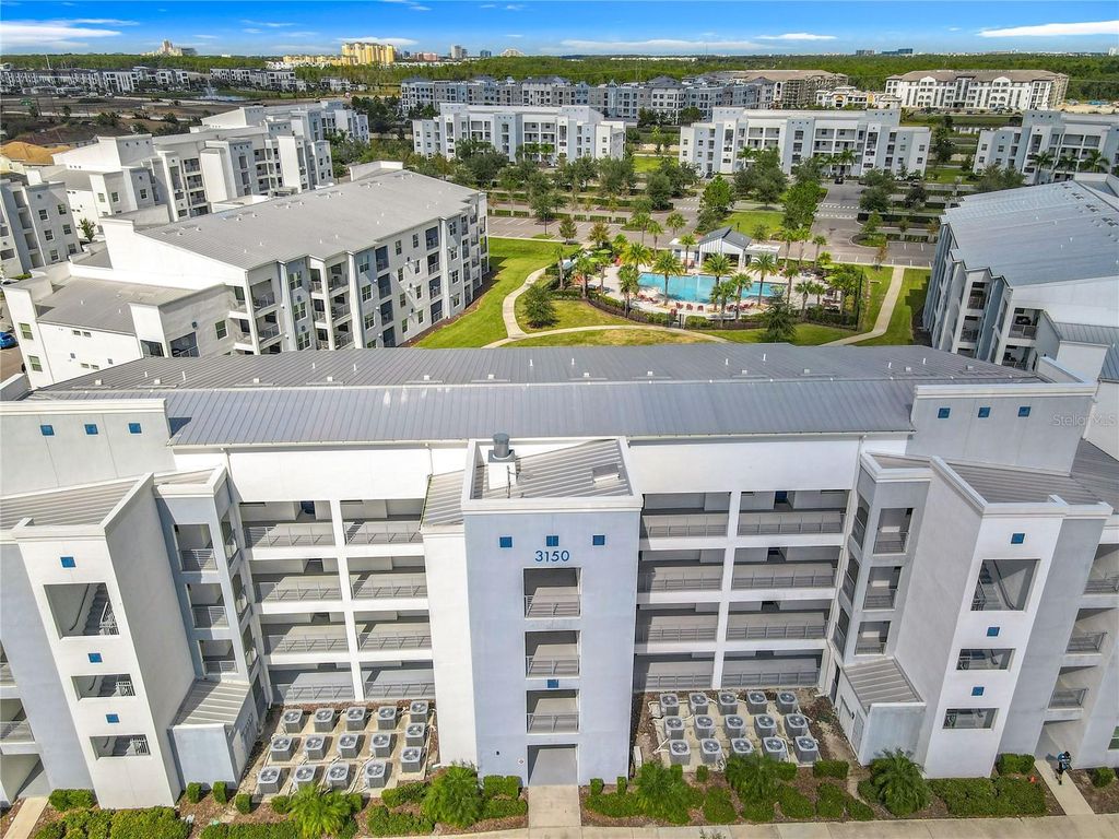 Photo of 3150 Paradox Circle #405, Kissimmee, FL 34746 (MLS # O6354937)