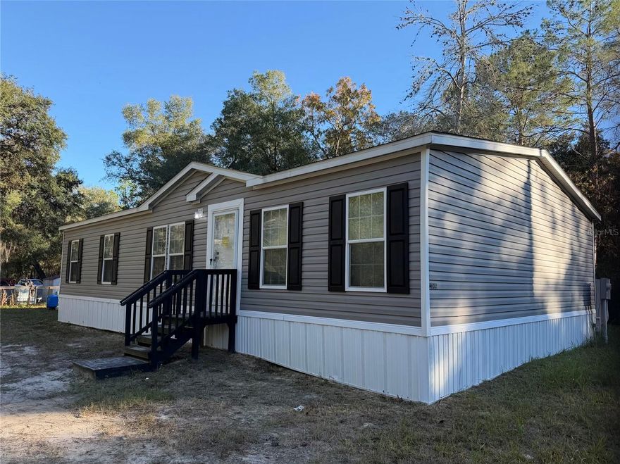 Gorgeous 4 bed 2 bath bath home in Fort McCoy. This spacious split floor plan has been recently refurbed with new painting throughout, brand new well, water heater, A/C and new kitchen appliances . The spacious kitchen including island with storage and seating, opens to the living and dining room which features a shiplap wall. The oversized laundry room has room for storage or freezer space.