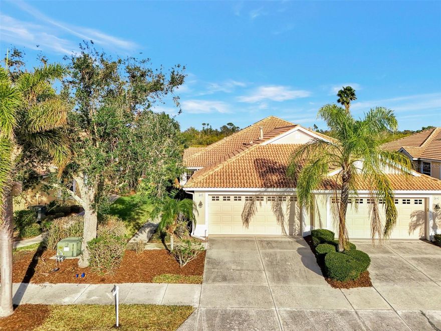 HERON CREEK GOLF & COUNTRY CLUB *TURNKEY FURNISHED *Paired Villa 2BED 2BATH +DEN with panoramic GOLF VIEW (#4 Oaks)! Available for Immediate Occupancy! This former Model is oozing with Coastal Charm, boasts over 1500 sq feet of well-designed living space and is perfectly suited for both seasonal escapes and year-round living! The desirable Bimini floor plan features a spacious open concept great room, versatile DEN/office, split bedroom plan for privacy, a fabulous Island kitchen w/sun filled dining nook and a spacious extended lanai overlooking the lush fairway! From the moment you walk through the beautiful leaded glass door you can’t help but appreciate the chic coastal casual décor and design. This villa surely shows like a model but lives like a home …it is stylish yet comfortable and inviting. Design and décor features include classic crown molding, shiplap and decorative millwork, custom window valances and drapes, decorative lighting and fans, stunning sand washed tile plank flooring throughout the living areas, tray ceilings, unique architectural details and niches, artistic wall treatments and perfectly suited furnishings and coordinating décor! The well-appointed Kitchen has abundant cabinetry and workspace, a NATURAL GAS range and is fully equipped with dinnerware, small appliances & pots and pans. Linens and Towels are also included for both bedrooms so all you really need is your suitcase! This villa could also be a great investment opportunity used as a seasonal rental (MIN RENTAL 3 MONTH). The den features a custom built in desk and workstation perfect for a home office. The Primary suite is bright and cheerful with a large double window and features a great window seat with hidden storage. The ensuite bath has dual vanities, a spacious walk-in shower, clothes closet, separate linen closet and has a tubular skylight that brings in abundant natural light. Guests can enjoy privacy in their own bedroom with adjacent full bath at the front of the home. This beautiful villa is ready to warm your heart just in time for Valentines Day! Heron Creek offers exceptional amenities including a 21,000 sq ft clubhouse, 27 holes of Championship golf Arthur Hills design, resort style pool & spa, a robust social activity calendar, fitness center, Tennis courts & formal & casual dining options! Club Membership is required with 3 membership levels offered beginning at $268/month *NO CDD FEES * LOW HOA FEES include lawn care, trimmings, mulching, irrigation, Cable HIGH-SPEED INTERNET &Gated entry, conveniently located w/easy access to I-75 & US-41, Cocoa Plum Shopping, Myakkahatchee Creek trails, WELLEN PARK, Braves Stadium, COSTCO & new SMH health