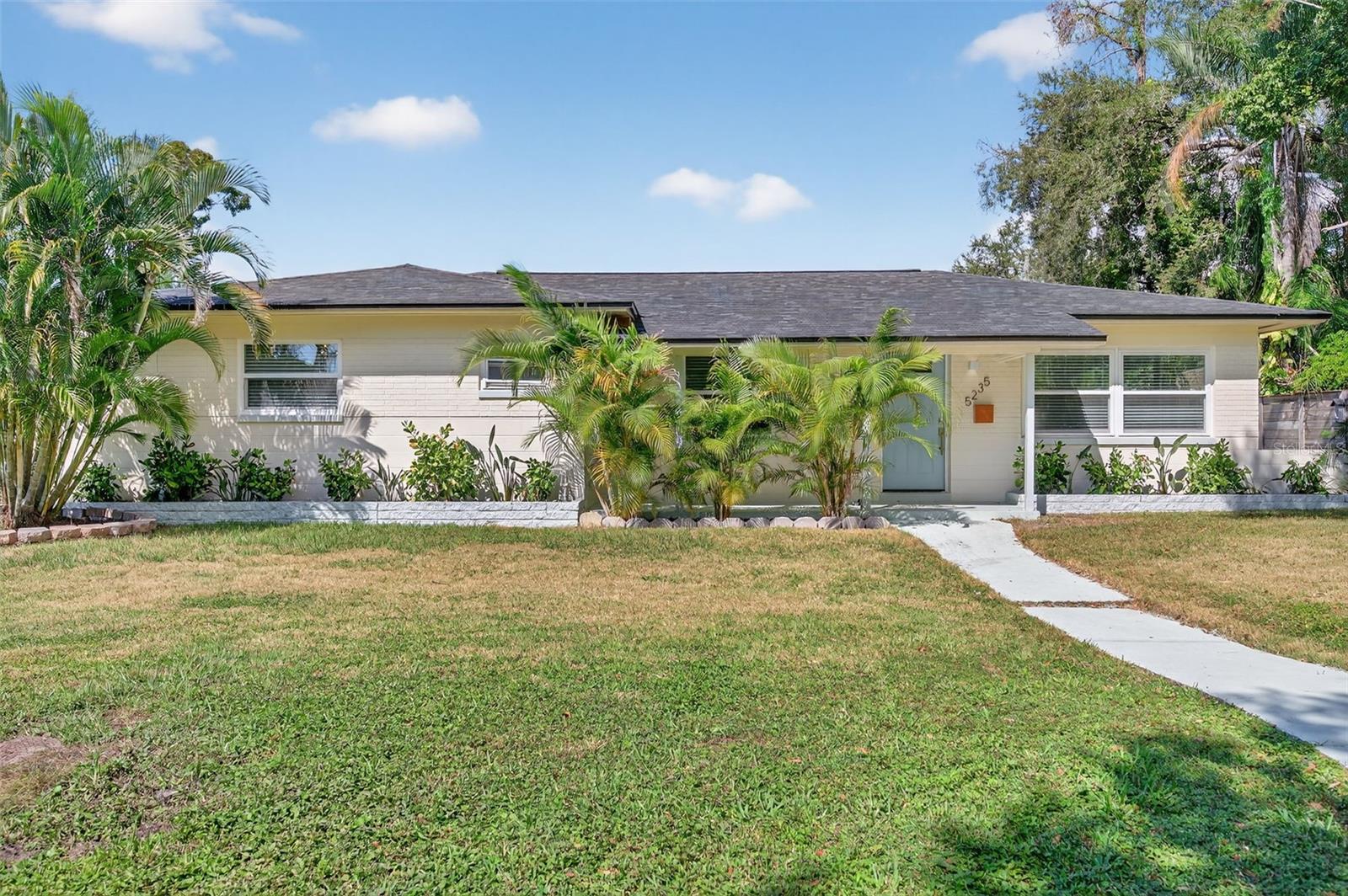 Welcome home to this beautifully renovated 3 bedroom, 2 bathroom, 1 car garage single-family home in St. Petersburg, offering modern upgrades and comfortable living throughout. Situated on a spacious quarter-acre lot, this home features new interior and exterior paint, new lighting, new LVP flooring, and beautifully updated bathrooms and kitchen. The spacious open-concept layout features a large living room, a separate dining area, and a sleek kitchen with an island, stone countertops, stainless steel appliances, a gorgeous backsplash, recessed lighting, and plenty of cabinet space. Off the living room is a bonus space perfect for an office or play area, plus a large laundry room for added convenience. The primary suite boasts an en-suite bath with dual sinks and a walk-in shower. Outside, you’ll find a fully fenced backyard with alley access, the rear facing garage, two carports and boat parking. Just minutes to the water yet located in a non-flood zone, this home offers the best of Florida living! Don’t miss your chance to make it yours—schedule your showing today!