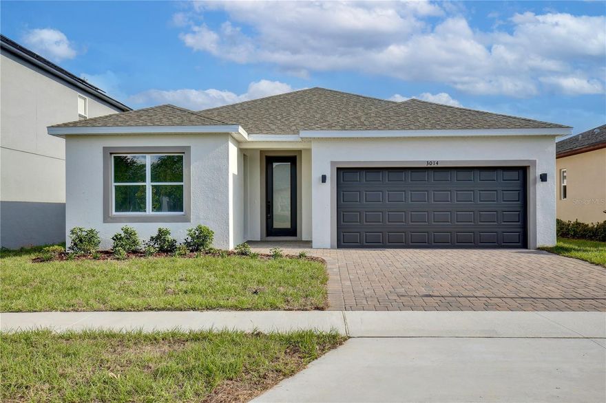 New Construction Single Story Multi-Generational Home. Fully Completed and Move-In Ready! TAKE ADVANTAGE OF UP TO $20,000.00 IN FLEX FUNDS, NO CDD FEES, and affordable HOA! Welcome to "The Harmonia," a modern, single-level home designed for flexible multi-generational living. With 2,200 sq. ft. and 5 bedrooms / 3 full baths, this beautifully crafted home is perfect for versatile living. The standout in-law suite features a private entrance, kitchenette, laundry, living room, and bedroom. This adaptable space can seamlessly blend into the main home or serve as a private living quarter. Enjoy soaring 11-ft ceilings in the foyer, a gourmet kitchen with quartz countertops and premium cabinetry, and a luxurious primary suite with a spacious walk-in closet and shower glass enclosure. Additional perks include luxury vinyl plank flooring throughout a two-car garage equipped with automatic opener, brick paver driveway and covered front/rear patio. Enjoy proximity to the Florida Turnpike, major shopping centers, and diverse dining options. Make this stunning new construction home in Groveland yours today!