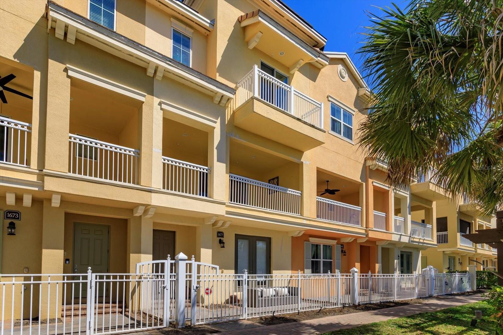 ELEGANT 3-Story Townhome on PRIME LOT! Only 2 Buildings are DIRECTLY ON LAKE with NO STREET BETWEEN YOU AND YOUR AMAZING LAKE VIEW! Also, this is 1 of 2 only Interior Buildings that have a DRIVEWAY TO ACCOMMODATE 2 CARS. Welcome to this stunning 3-story townhome located in the Luxurious Gated Community of GRANDE OAKS AT HEATHROW, where luxury and convenience thrive in the heart of Lake Mary. The Community Association Construction Project on this building is almost completed. NEW WINDOWS, BALCONY SLIDERS, ROOF, STUCCO, EXTERIOR PAINT, BALCONY, RAILINGS, GUTTERS/DOWNSPOUTS and LANDSCAPING & UPDATED PATIO FENCING to come. Great Time to Purchase! This impeccably designed 3 BEDROOM, 3.5 BATHROOM, PLUS BONUS ROOM AND 2 CAR GARAGE residence offers elevated living with style, space and sophistication at every turn. Step inside through a charming, landscaped PAVERED FRONT PATIO and instantly feel at home. The first floor has a Spacious Ground Floor Bonus/Den/Office with DOUBLE ENTRY DOORS. Also a second set of Double Doors that Lead to Patio. Can be used as a 4rd bedroom with its own Full Bath, Graced with Tile to Ceiling Shower and Comfort Height Vanity with Granite Counter. The second-floor main living area is the heart of the home, featuring a Kitchen, Living Room with Tray Ceiling and Dining Area layout all bathed in Natural Light, plus Half Bath. Step out onto your SPACIOUS BALCONY, perfect for morning coffee or evening relaxation with STUNNING LAKE VIEW! Inside, you’ll find TILE FLOORING throughout, PLUSH CARPET in the bedrooms and a BRIGHT, NEUTRAL PALETTE ideal for any interior design style. The chef’s kitchen boasts stunning GRANITE COUNTERTOPS, GE STAINLESS STEEL APPLIANCES, 42" WOOD CABINETS and MASSIVE KITCHEN ISLAND, SLEEK TILE BACKSPLASH and PANTRY, ideal for both everyday living and entertaining. Upstairs retreat to your Luxurious Master Suite, complete with TRAY CEILING, LARGE WALK-IN CLOSET and another PRIVATE BALCONY to enjoy your Stunning Lake View! ENSUITE has DUAL VANITIES, GRANITE COUNTERS and an elegant STAND-ALONE SHOWER designed to impress. There are 2 other Generously Sized Bedrooms that share a Full Bath. Laundry Closet is conveniently located on this floor as well. This layout is thoughtfully planned with privacy and function in mind, including a rear-facing 2 CAR GARAGE/EPOXY FINISH and Generous Storage throughout. The Grande Oaks at Heathrow Community offers resort-style amenities, including a CLUBHOUSE, SPARKLING POOL/SPA, FITNESS CENTER, TOT PARK and BASIC CABLE all included in HOA DUES! Exciting news in January FIBER INTERNET will be included in HOA DUES replacing basic cable. Located in one of Seminole County’s most desirable areas, this townhome is more than a home, it’s a lifestyle. Have peace of mind in this secure, Gated Neighborhood, nestled just minutes from I-4, 417, and 429. Walk to Colonial Townpark to enjoy upscale dining, shopping, and entertainment, or take a short drive, just 45 minutes, to soak in the sun at the beach. Don’t miss your chance to own this majestic retreat in Lake Mary. Call Today for your Private Showing, before it’s gone! This property may be under audio or visual surveillance!