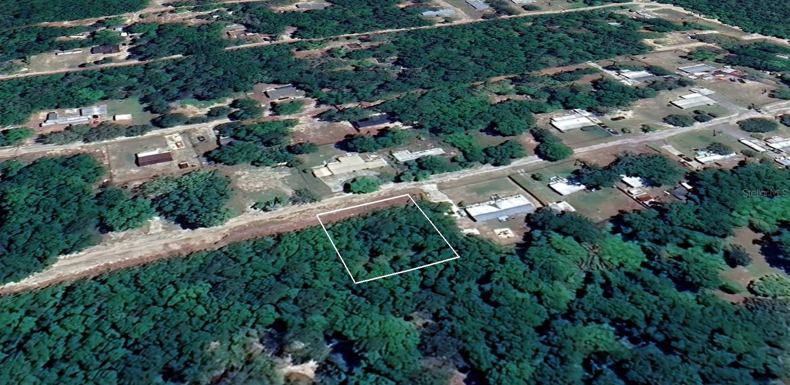 Amazing opportunity to purchase a .3 Acre parcel. Mobile Homes allowed. Nestled in the heart of Marion County, this 12,632-square-foot wooded retreat offers a prime opportunity for residential or mixed-use development under its R-4 zoning. Spanning roughly 125 ft by 100 ft, this fully treed parcel presents both peace and privacy, making it an idyllic canvas for your future home or creative vision. While utilities are not yet in place—the lot currently awaits installation of a well and septic system—a blank slate like this invites you to design and build exactly the way you’ve always imagined. Accessible via a quiet dirt road, the lot combines rural serenity with the flexibility and potential offered by its zoning. If you’re seeking a tranquil escape in Marion County, with customization options and future upside, this parcel is a rare find.