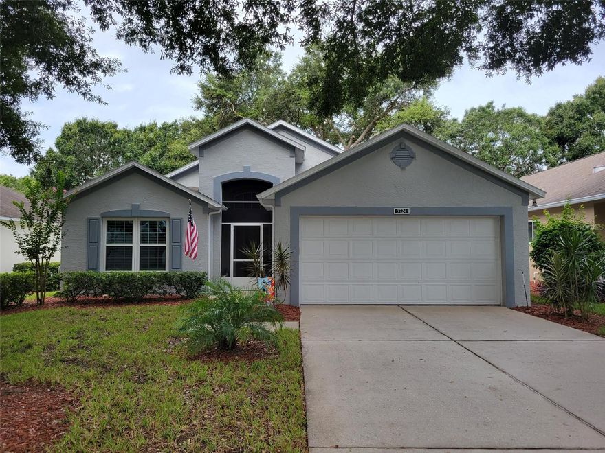 Magnificent home in highly sought-after 55+ Kings Ridge. This lovely Sherwood model boasts two spacious bedrooms and two baths with 1410 square feet of living space. Entering the home at the foyer features  a Great Room Floorplan with a spacious Living Room.  Just off the Living is a gourmet kitchen with Breakfast Nook.  The Great Room opens up to the Covered Screened Lanai through a sliding glass door.  The primary bedroom features an En Suite bathroom. Home includes a 2 car garage with door opener. Interior laundry Room with Full Sized Washer & Dryer included. All kitchen appliances are also included in the sale.  Also included in the sale is the massive 85 inch TV in the Living Room.  Enjoy the safety of a guard gated community and beauty of tree lined streets and amazing community amenities including a multi-million-dollar clubhouse. Live the Royal lifestyle with two 18-hole golf courses, three heated pools, two fitness centers, spas, tennis & pickle ball courts, billiards, shuffleboard, shows, Bingo, Dancing, cards, crafts, movie & food truck nights and join any one of the many clubs galore. HOA dues include lawn maintenance & irrigation, exterior painting, landline phone, basic cable and internet and all community amenities. Close to Highway 27 and 50, Florida Turnpike with easy access to downtown Orlando within 30 minutes & twenty-two miles to Disney. Conveniently located outside the community: golf cart accessible Publix, University of Florida urgent care center, doctors, dentists, Walgreen’s pharmacy, Quest and close to Costco, Kohls, Walmart, BJs and numerous restaurants within five miles. At least one buyer must be at least 55 years old or older for HOA approval. Age of Items: Interior Paint - November 2024; Exterior Paint - June 2024; New Energy Efficient Windows - July 2022; Plantation Shutters - July 2022; Luxury Vinyl Plank Floor installed throughout the home - July 2022; New Washer & Dryer - 2022; New Toilets - 2022.  Call for a private tour of this fantastic home.