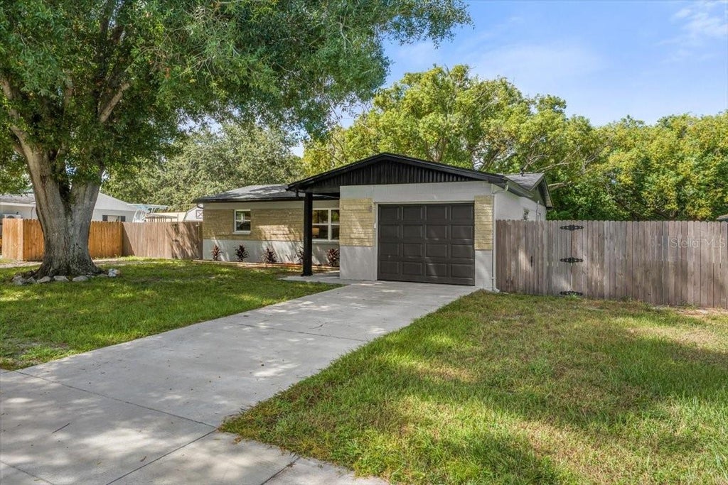 Photo of 14756 Mockingbird Lane E, Clearwater, FL 33760 (MLS # TB8554329)