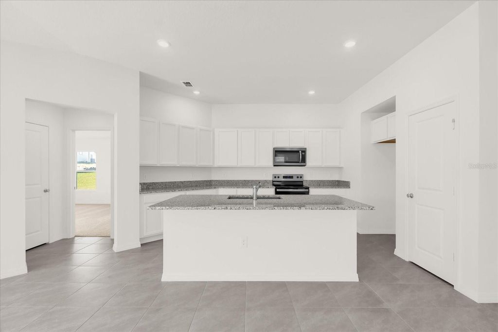 Photo of 568 Mahogany Way, Dundee, FL 33838 (MLS # O6331044)